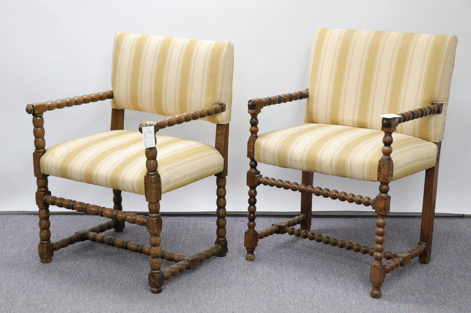 2 English Baroque Cherry Bobbin-turned Armchairs: Two English Baroque Cherry Bobbin-turned Armchairs, upholstered in taupe cloth, one later Dimensions: 35" H x 24" W x 21" D Property from the Greenwich Village townhouse of Dr John Downey's Estate (NY