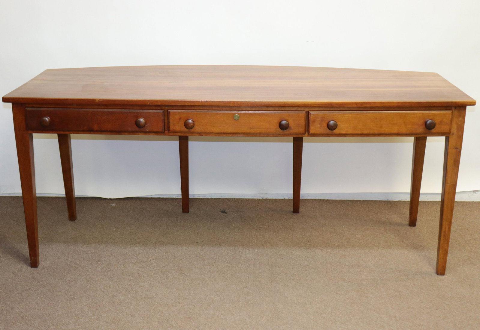 Manner of Ian Ingersoll Cherry Bowfront Desk: Manner of Ian Ingersoll Shaker style bench made Cherry Bowfront Desk Dimensions: 30 x 72 x 30 Property from a Litchfield CT home (PMRI9416)(MM)