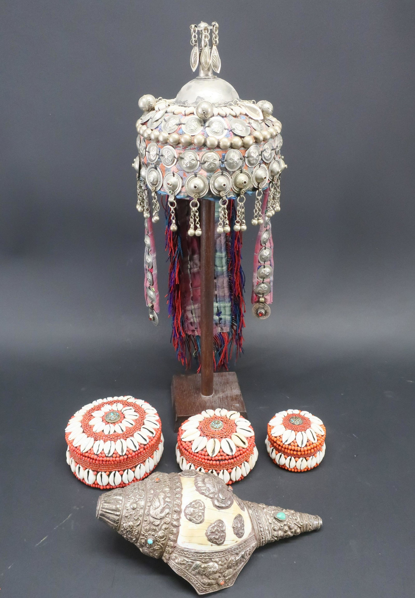 Group of Misc. Shell Items: Turkomen Wedding Hat from Afghanistan, Indian silver mounted shell & 3 modern African shell boxes Dimensions: Hat 21" H x 7" Dia., Shell 10" L x 4 1/2" W Property from the Estate of C. Carter Walker J