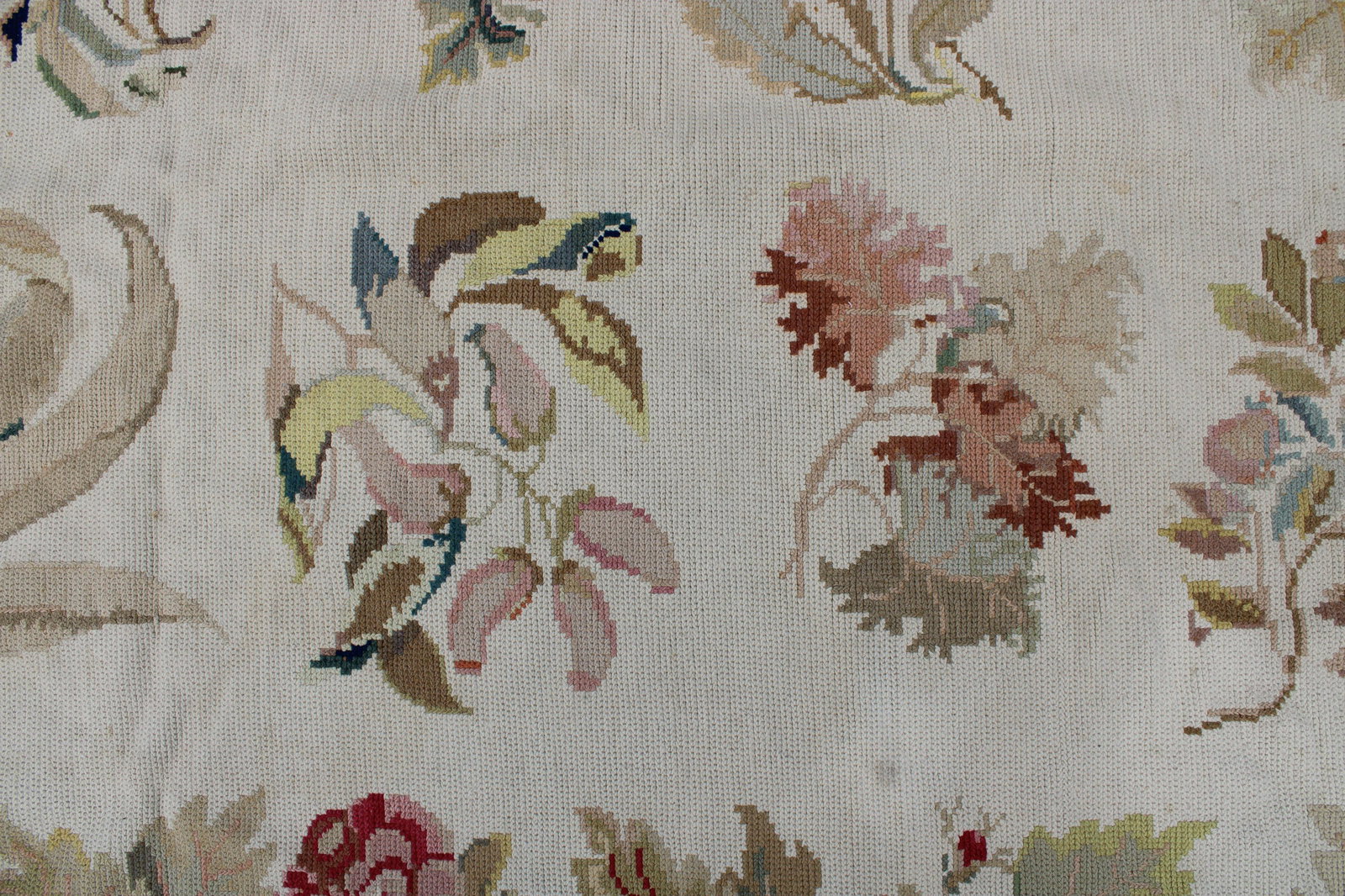 Needlework Rug, Probably Portuguese, 6 x 9: Needlework Rug, Probably Portuguese, 6' x 9'1", flowers and leaves on a beige ground Dimensions: 6' x 9'1" Property from the Litchfield Estate of Tracy H. Griswold (TGLI8062)(WT)