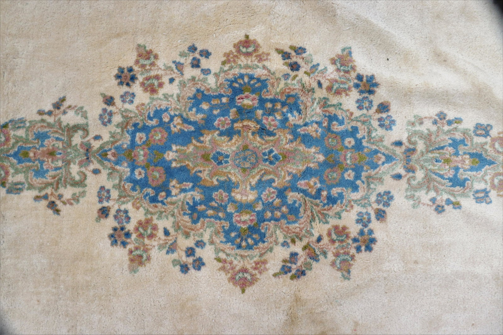 Kirman Rug, 8 x 10: Kirman Rug, 7'9" x 9'9", ivory field with blue/green pole medallion, blue border Dimensions: 7'9" x 9'9" Property from the Greenwich Village townhouse of Dr John Downey's Estate (NYDOW8658)(WT)
