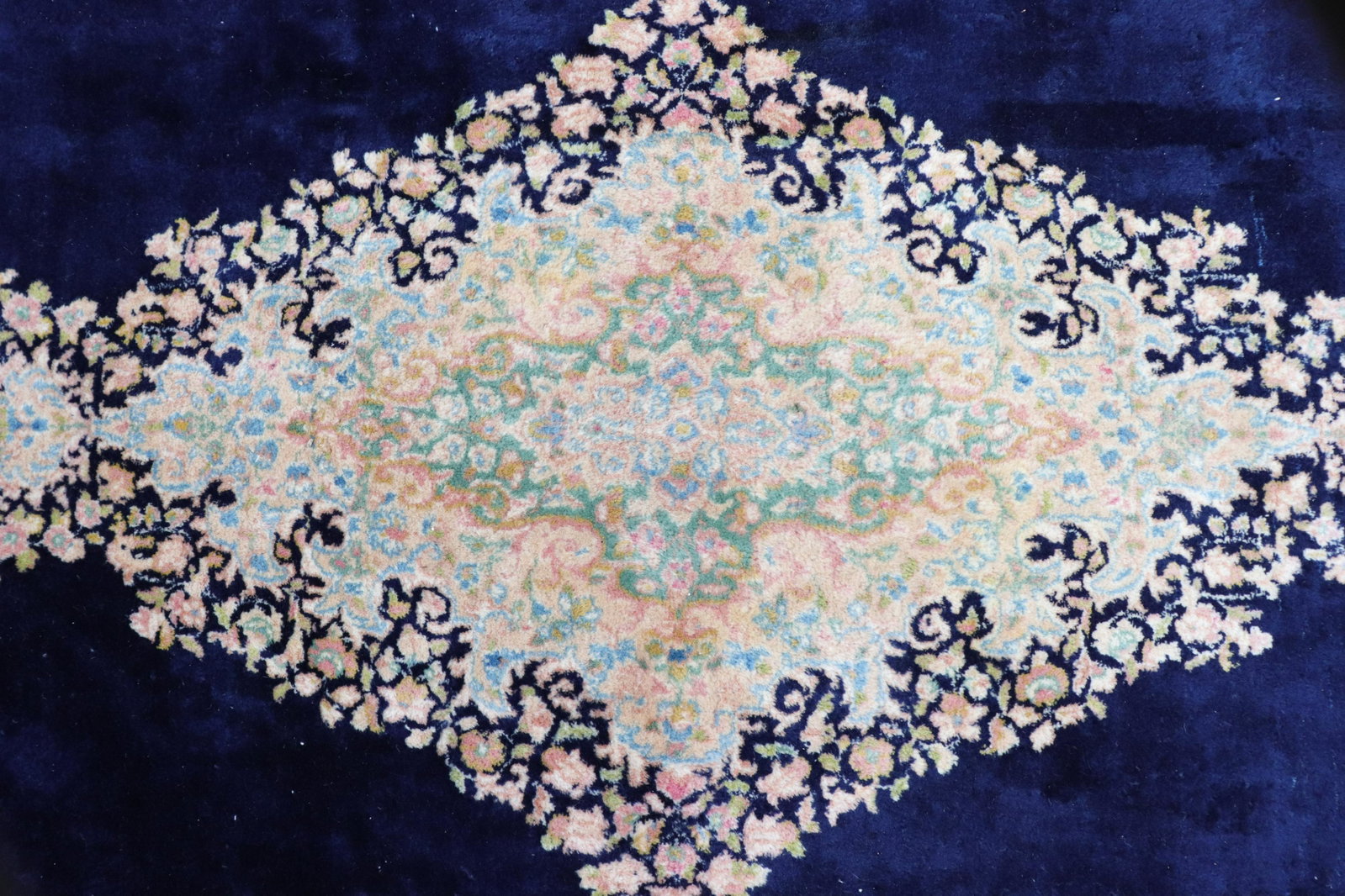 Kirman Carpet, 8 x 17: Kirman Carpet, 8'6" x 17'6", pastel pole medallion on midnight blue ground, green/pink border Dimensions: 8'6" x 17'6" Property from the Greenwich Village townhouse of Dr John Downey's Estate (NYDOW86
