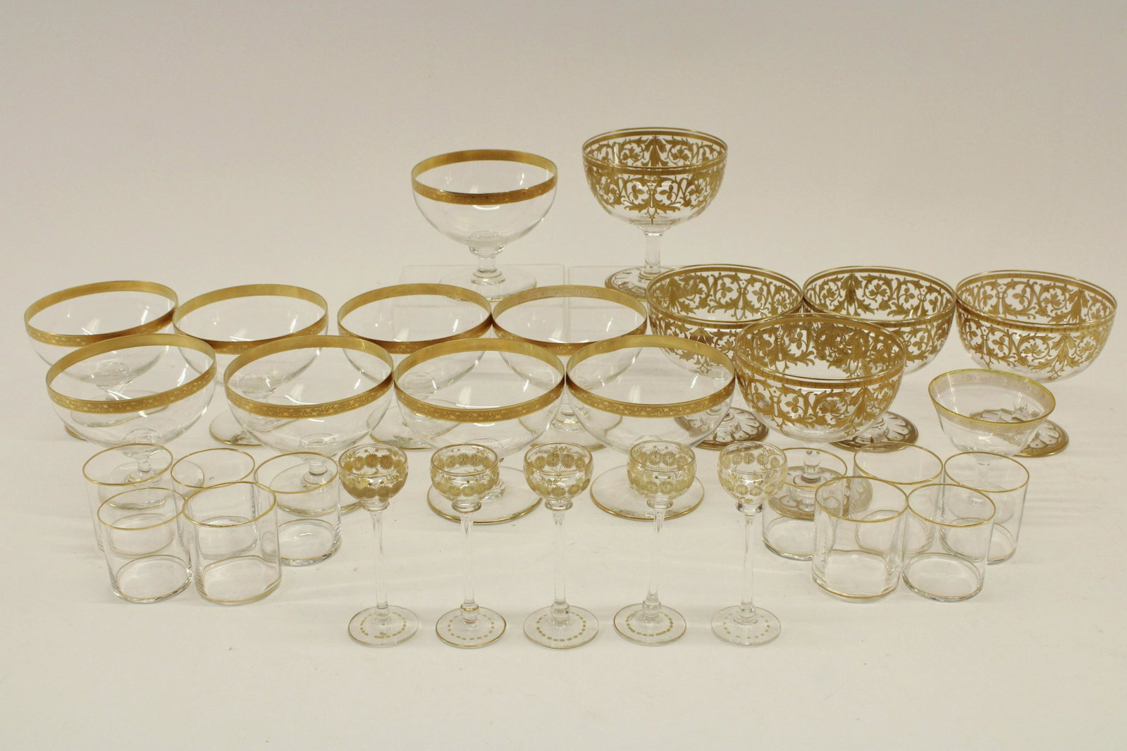Victorian Era Gilt Paint Czech/Bohemian Glassware: Assortment of Victorian Era Gilt Paint Decorated Czech/Bohemian Glassware, possibly Moser, includes 9 shrimp cocktail glasses with insert cups, 5 large goblet glasses without insert cups, one white wi