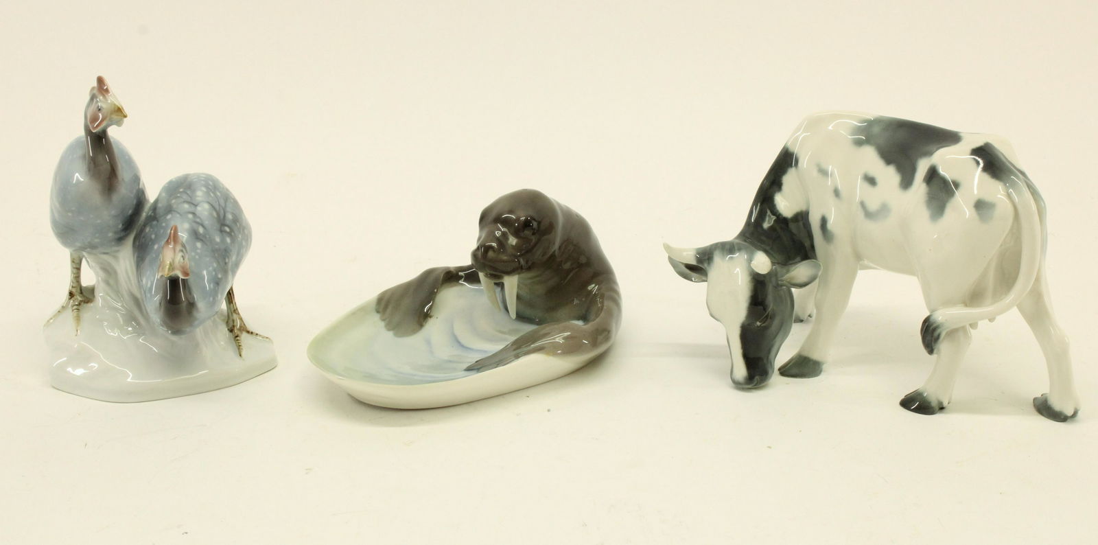 3 Rorstrand Porcelain Animals, Sweden: 3 Rorstrand Porcelain Animals, Sweden, 'Guinea Hens', 'Walrus' dish and 'Cow' Dimensions: Cow 5 1/2" H x 8" L Property from the collection of a Massachusetts professor. (STES8084/3)(WT)