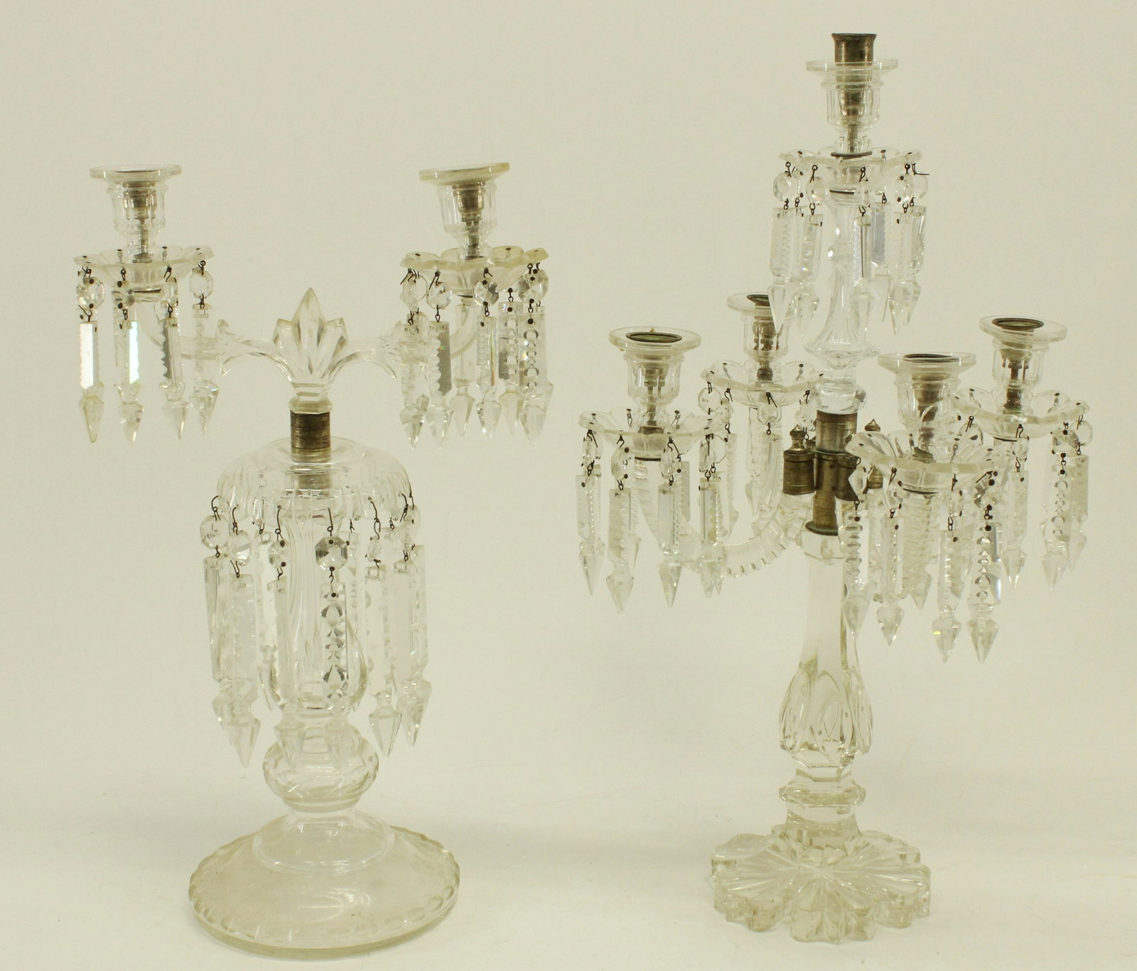 2 Cut Glass Candelabrum: 2 Cut Glass Candelabrum, one of Baccarat type, and extra drops/parts Dimensions: 22 1/2" H x 13 1/2" W and 19 1/2" H x 11 1/4" W Property from the Litchfield Estate of Tracy H. Griswold (TGLI8076/2)(W