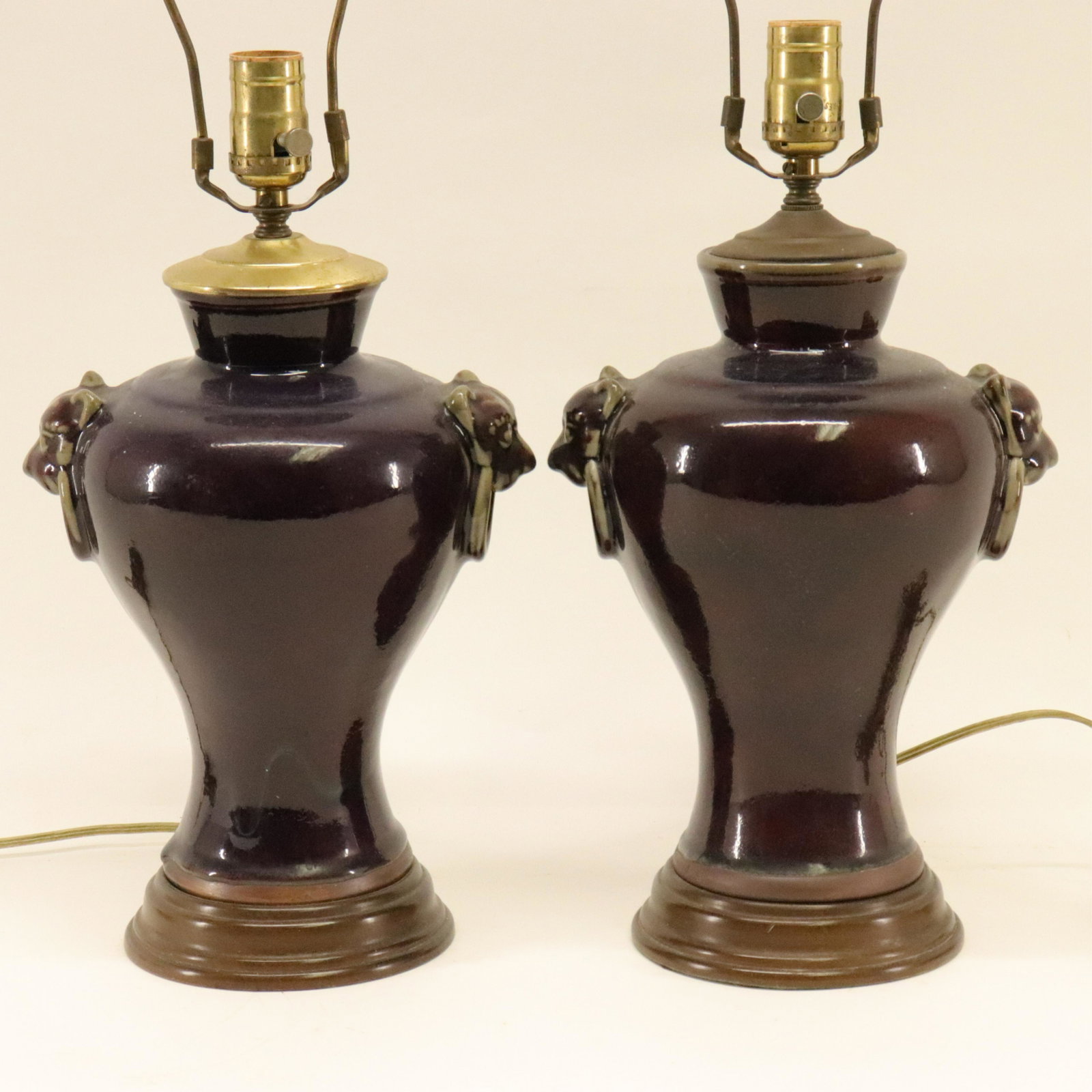 Pair Chinese Sang de Boeuf Vases as Lamps: Pair Chinese Sang de Boeuf Vases as Lamps, Fu Lion mask ring handles Dimensions: Vase 11" H x Overall 25" H Property from the Estate of Sara E. Vagliano (DVIA9379/2)(WT)