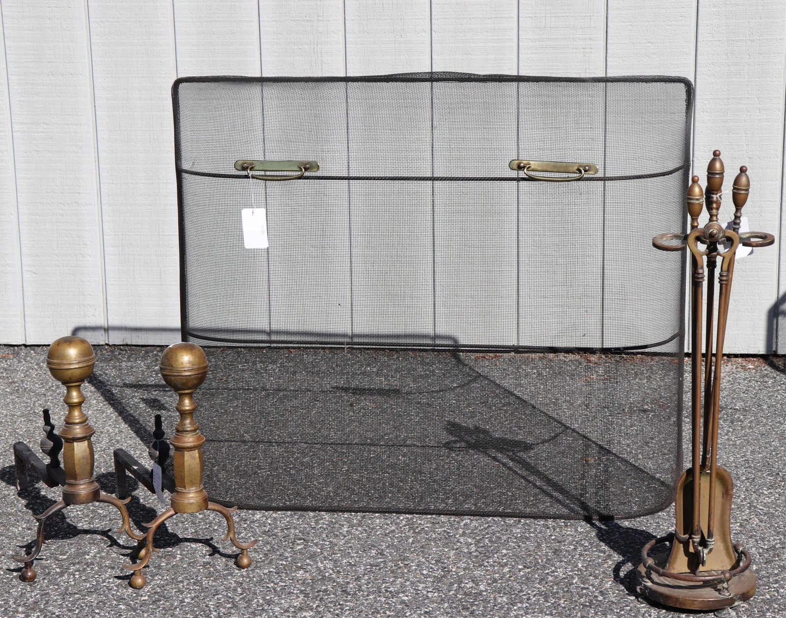 Pair Brass Andirons, Tools and Fire Screen: Pair Brass Andirons, Tools and Fire Screen Dimensions: Fire screen 31 1/4" H x 38" W x 8"D, Andirons 16 1/2" H Property from the Estate of Jack Richmond being auctioned to benefit Prime Time House, of