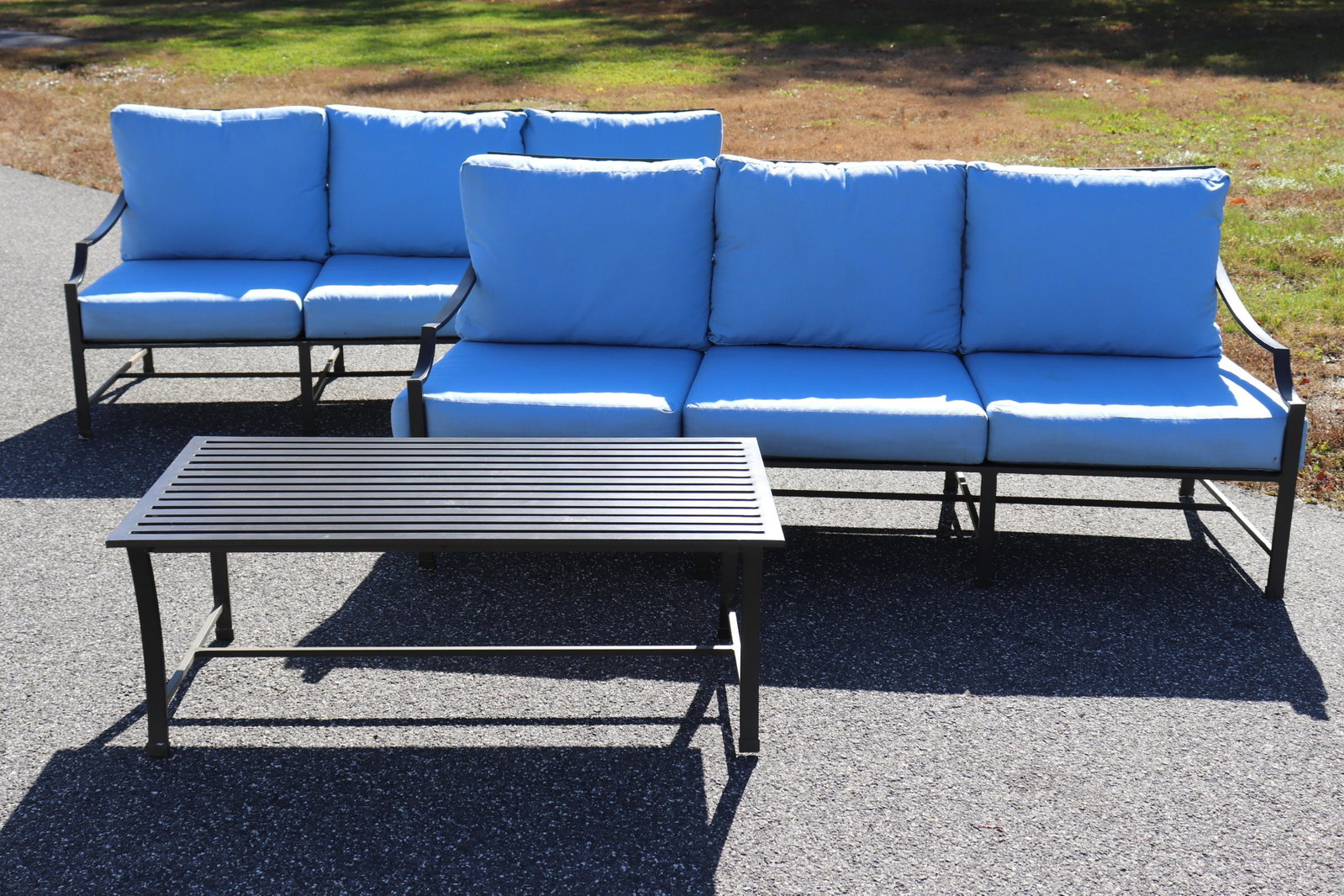 Restoration Hardware Outdoor Sofas Table: Pair of Neoclassical Style Metal Restoration Hardware Sofas and Cocktail Table, blue cushions Dimensions: 33 x 75 x 36, cocktail table 16 x 44 x 26 Property from the Estate of Jack Richmond being auct