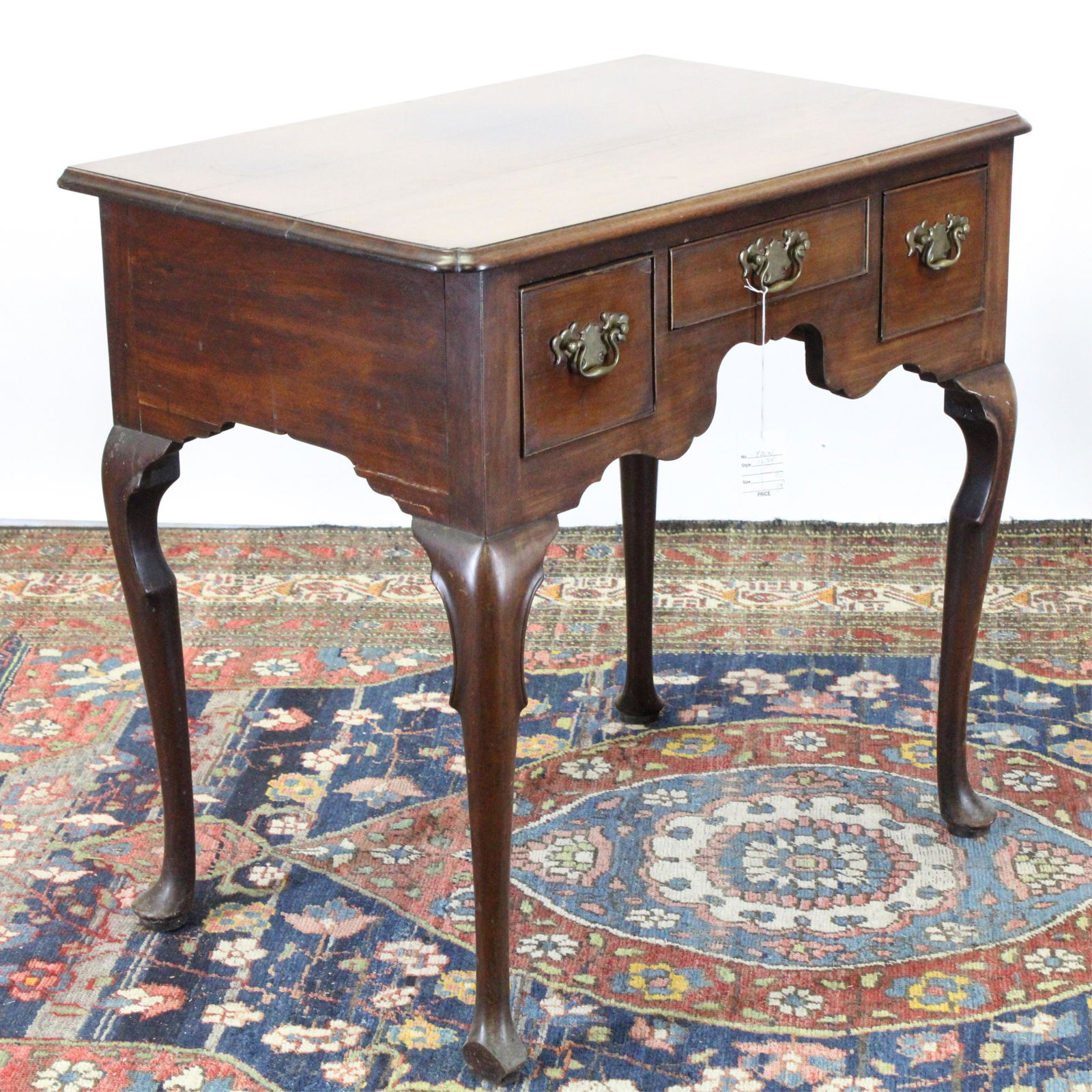 English Three Drawer Lowboy: Shaped apron, knees. Dimensions: 29.75"H x 31.75W x 20.5 deep Property from a Connecticut home (PDON1234)(JP)