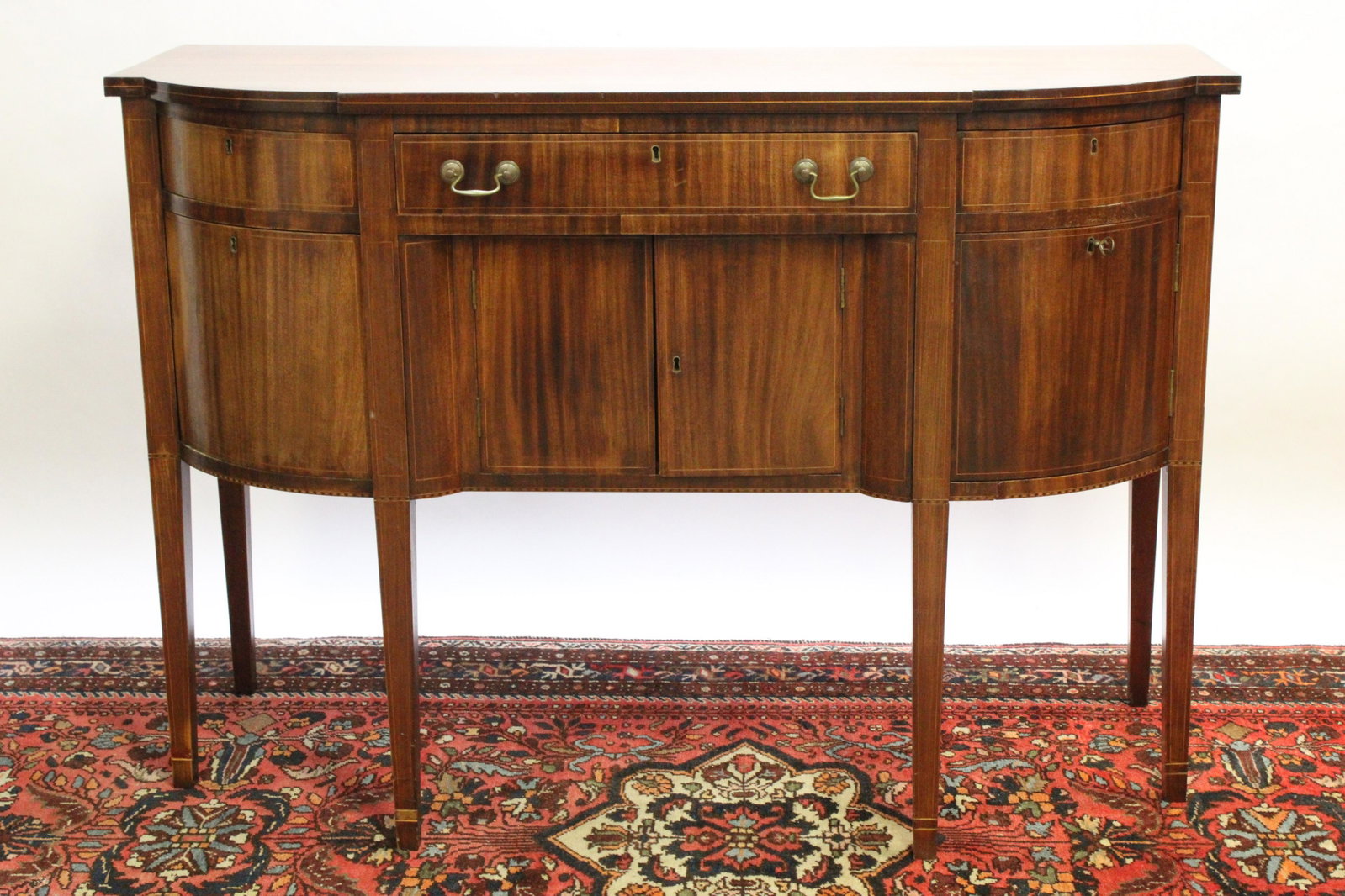 Centennial Hepplewhite Mahogany Sideboard: Centennial Hepplewhite Mahogany Bow Front Sideboard, inscribed on back of drawer "Made by Edwin Leete and Edward M. Leete of Guilford, Conn., Property of Edward Leets Hall", 3 drawers over 2 drawers a