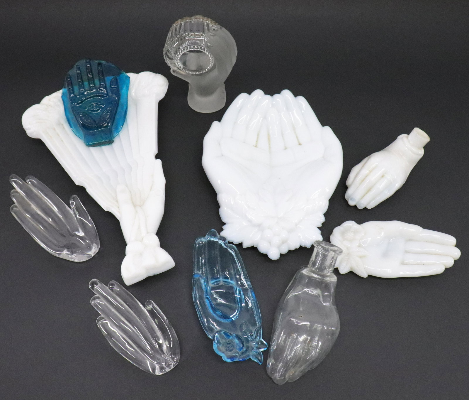 10 Glass Hands and Perfume Bottles: 10 Glass Hands and Perfume Bottles, milk, colored, clear & frosted Dimensions: 4" H to 9 1/2" H Property from the Litchfield Estate of Tracy Griswold (TGLI9187/10)(WT)