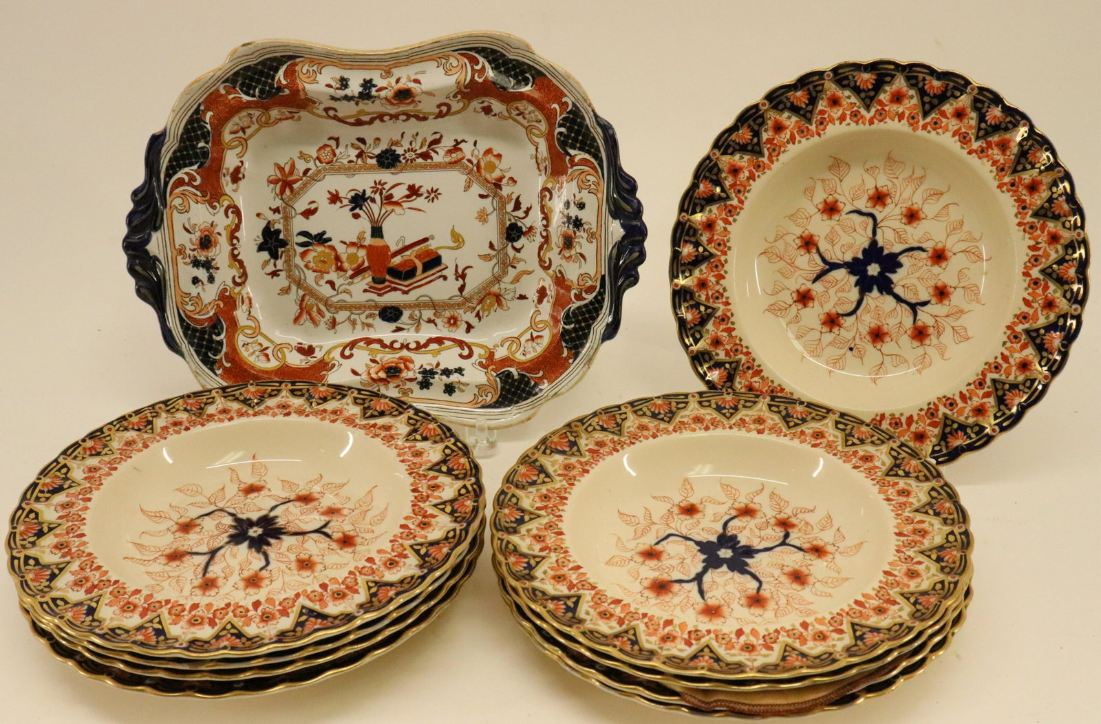 English Imari Ironstone Serving Dish & Soups: English Imari Decorated Ironstone Serving Dish, 19th C., and 9 porcelain soup plates Dimensions: Dish 12 3/4" L, plates 9 3/4" dia. (AVIC9280/10)(WT)