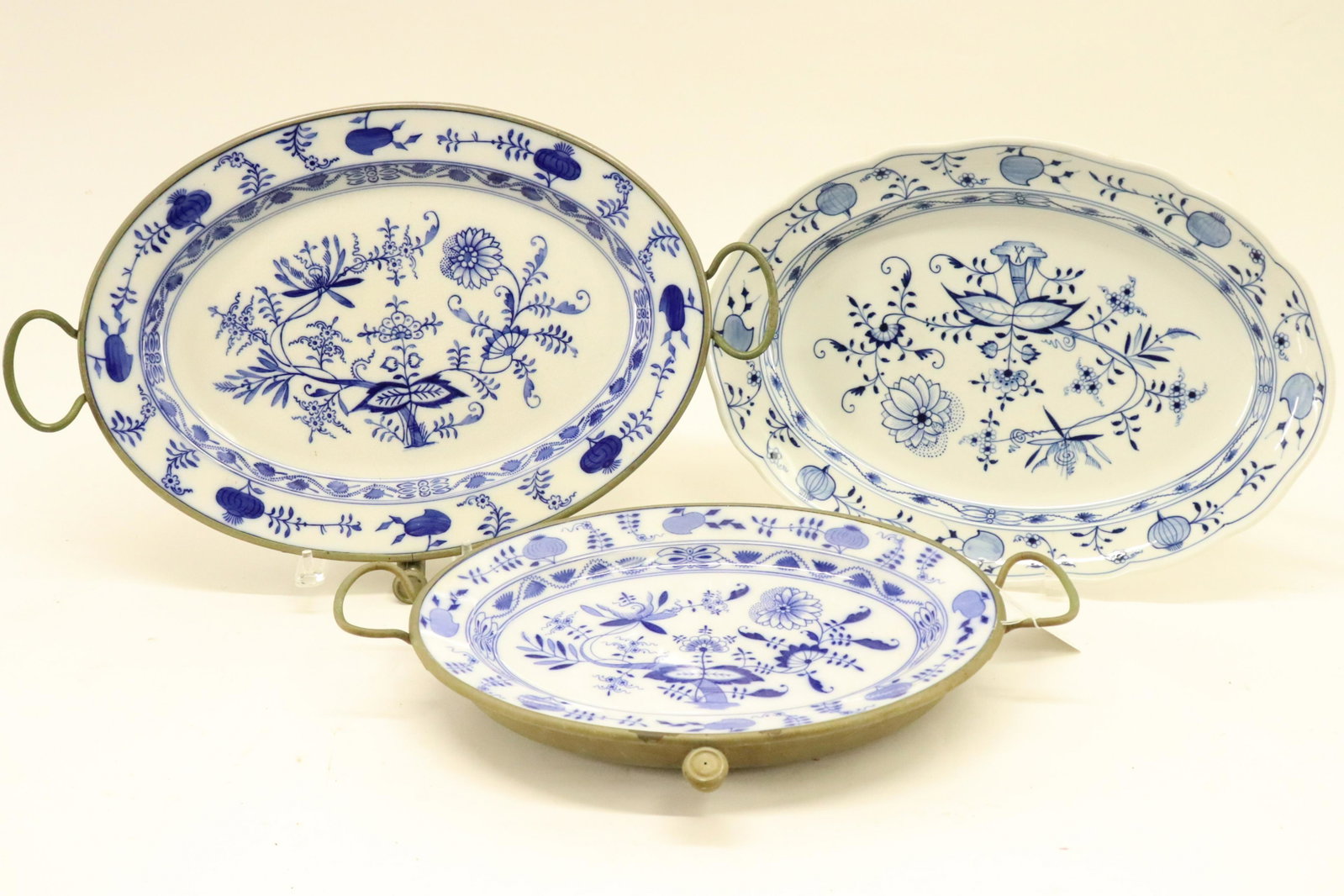 3 Meissen Porcelain Platters, Blue Onion pattern: 3 Meissen Porcelain Platters, Blue Onion pattern, one with visible underglaze blue crossed swords, and printed stamp German, 2 with metal warming pans attached, stamp Bavaria Dimensions: 16 1/2" L to 