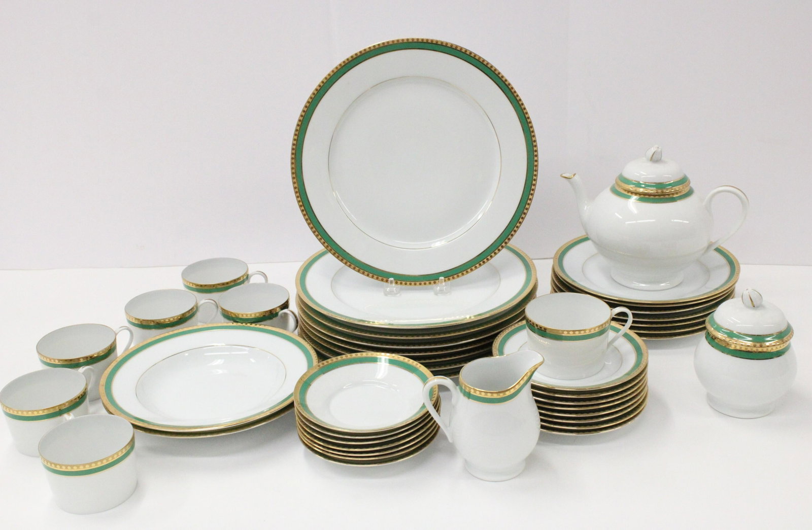 Tiffany/Limoges Dinner Svc., Green Band: Tiffany/Limoges Porcelain Dinner Service, "Green Band", comprising: 8 dinner plates, 10 3/4" dia.; 7 luncheon plates, 8 1/2" dia.; 2 soup plates, 8 3/4" dia; 7 cups & saucers; 8 bread & butter plates;