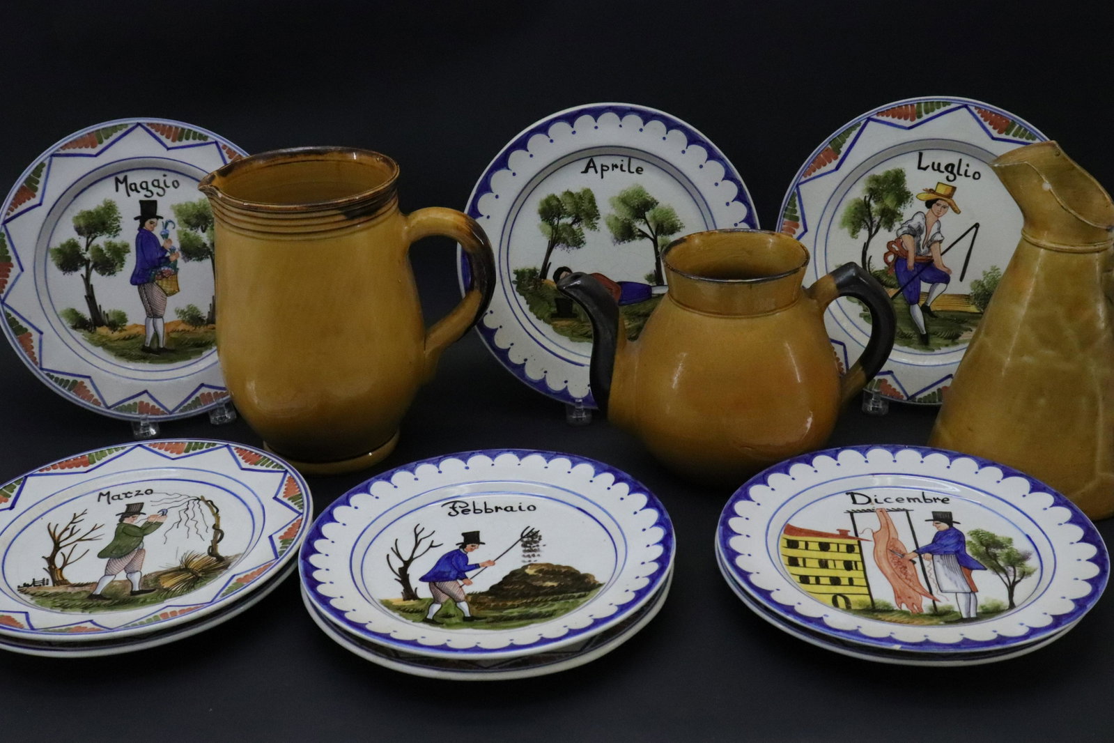 12 Spanish & French Pottery Tablewares: 12 Spanish & French Pottery Tablewares, comprises: 9 calendar plates & 3 Aegitna Vallauris pitchers/pots Dimensions: Plates 8 3/4" Dia., Vallauris 6" H to 9" H Property from the Estate of Sara E. Vagl