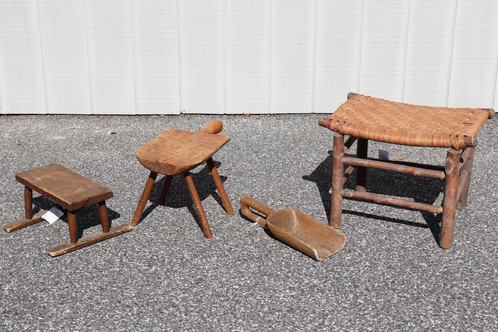 Country Wood Accessories: Rustic Limb Stool, Etc.: Four unique country accessories. Limb stool with woven splint seat. "Breadboard" stool. Small stool with sled runner- like feet. Carved grain scoop with closed loop handle. Dimensions: Limb stool 14" 