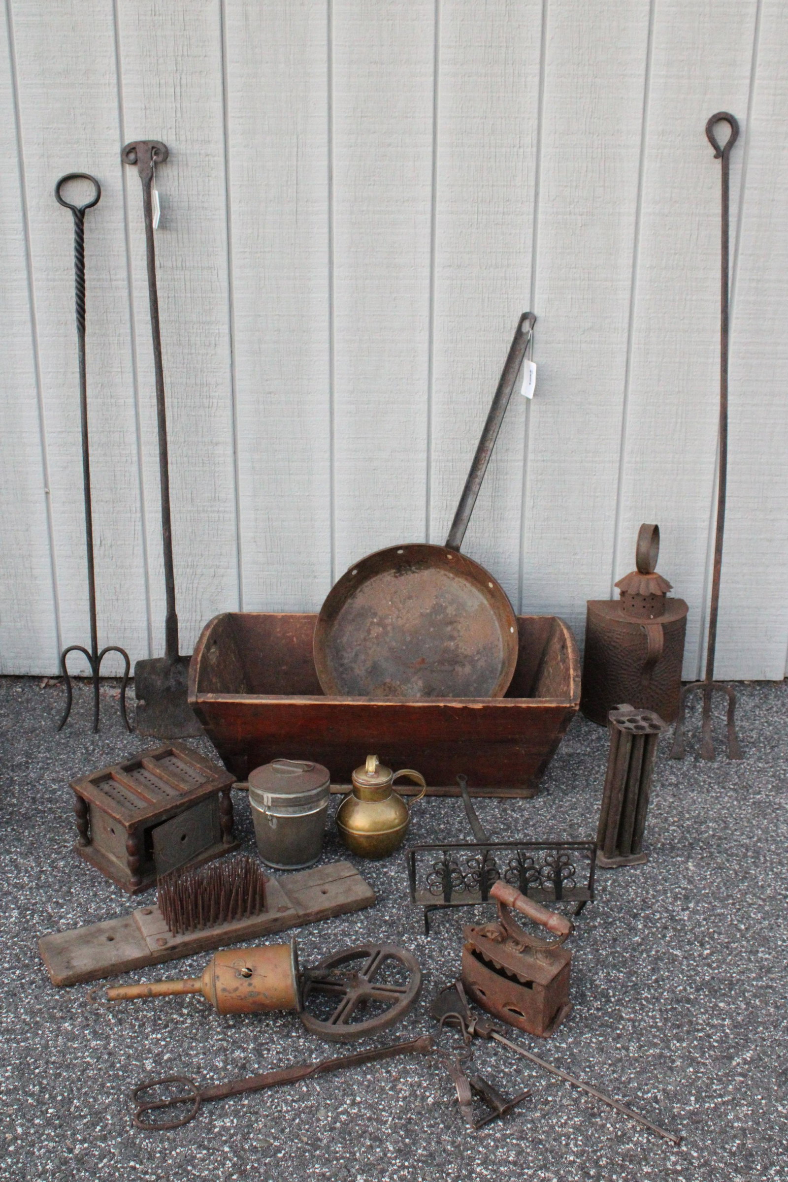 Group of Early American Iron Home & Hearth Items: Group of Largely Early American Iron Hearth Items, and Household Equipment, includes large fire tools, cooking implements, one candle mold, foot warmer, flat iron, lantern, balance scale, a brass Geo.