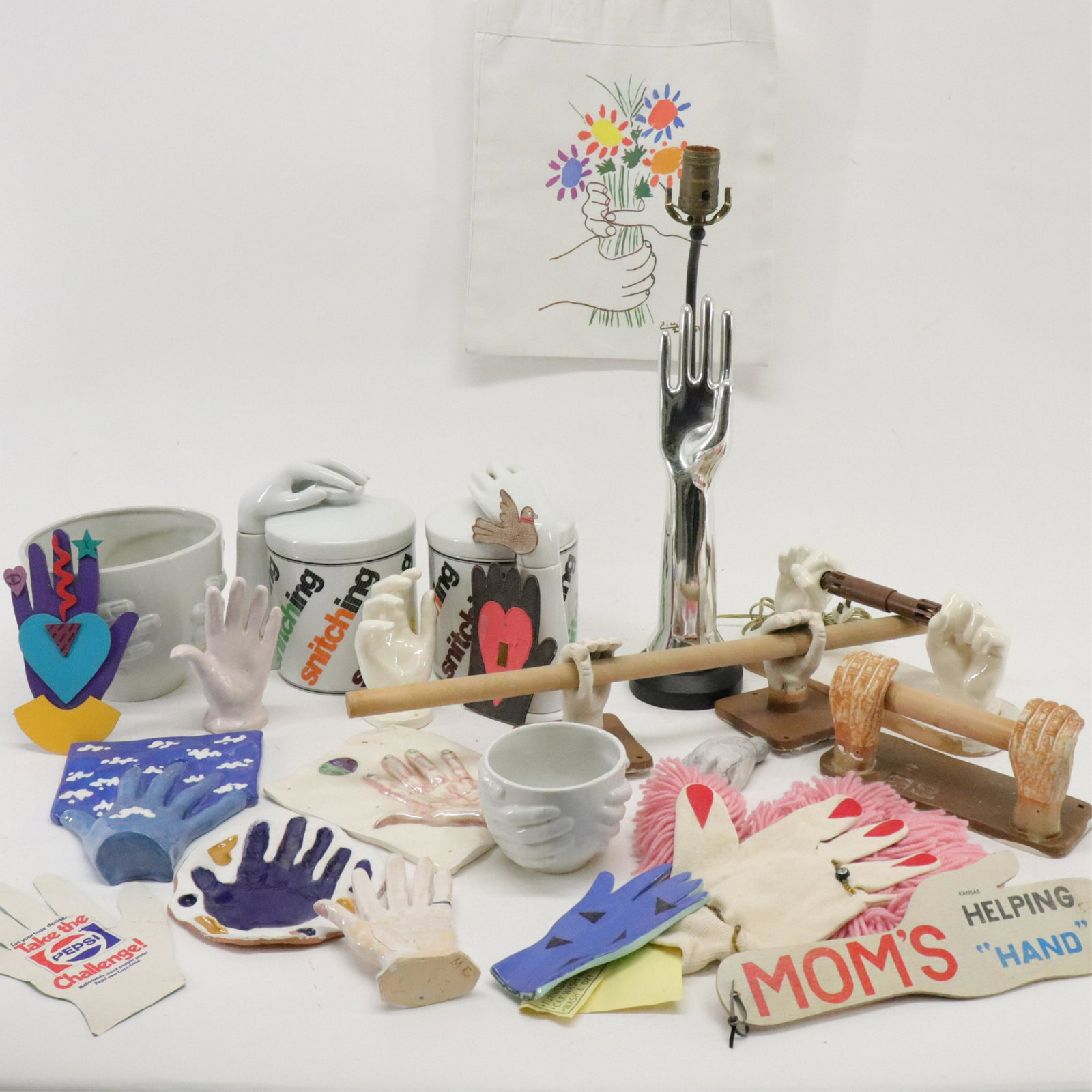 Modernist Collections of Hand Theme Items: Modernist Collections of Hand Theme Items, includes toilet paper holders, cookie jars, lamp, bowls, shopping bag after Picasso, etc. Dimensions: Lamps overall 21" H, large bowl 6 1/4" H x 8" dia. Prop