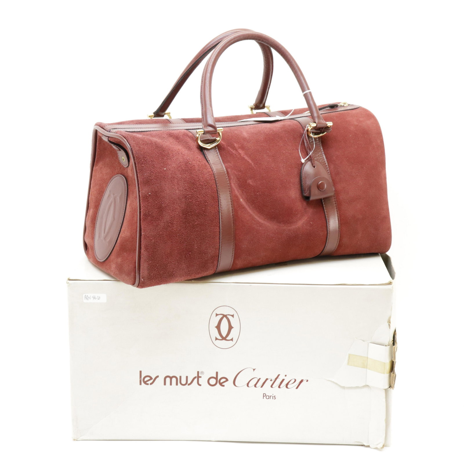 Cartier - Les Must De Cartier Boston Bag: Cartier - Les Must De Cartier Boston Bag, Cognac Red Suede Leather. Includes Box, Cadenas in Clochette, Keys. Dimensions: 47x22x20cm