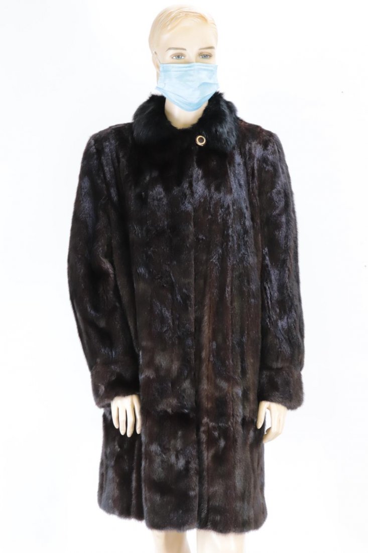 Natural Mink Coat: Natural mink 7/8 coat. Silk lining with extra fur for repairs, 3 hook and eye closures, top button at neckline, front slip pockets. 16" underarm to sleeve hem, 22" underarm to underarm, 18" across sho