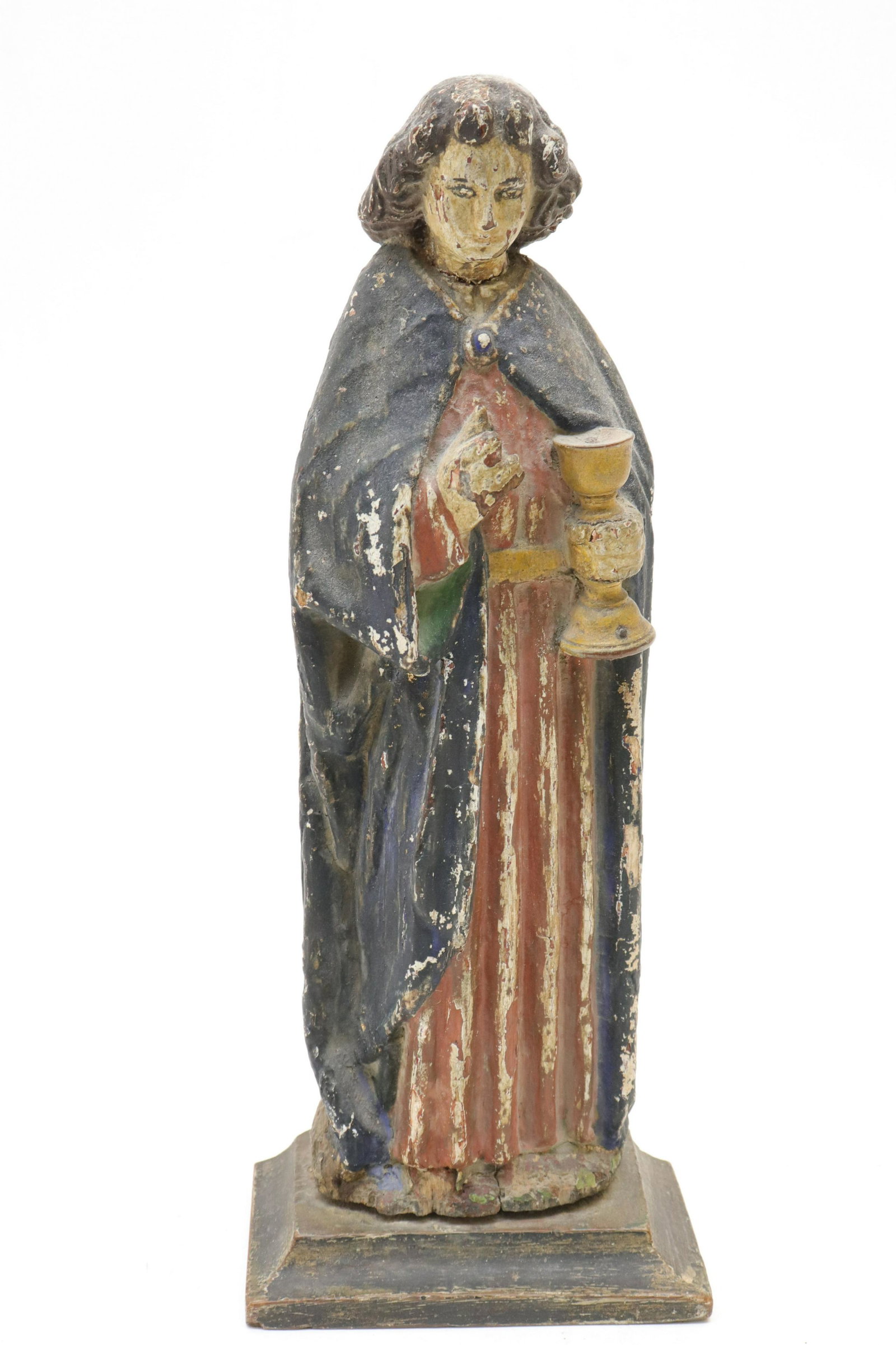Spanish Colonial Figure of a Saint: Spanish Colonial Figure of a Saint, carved and polychromed, with gilt chalice, on plinth (RIJO2324)(WT) Dimensions: 12 1/2" H x 4 3/4" (overall) Property From the Estate of Richard I Johnson (1925-202