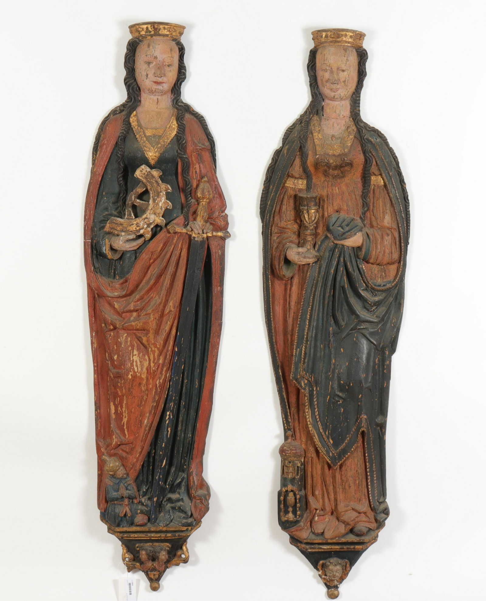 2 Figures of Saints, 17th C., Catherine & Barbara: 2 Continental Baroque Appliques of Saint Catherine & Saint Barbara, possibly North German, 17th C. (RIJO2664/2)(WT) Dimensions: 58" H x 14" W Property From the Estate of Richard I Johnson (1925-2020),