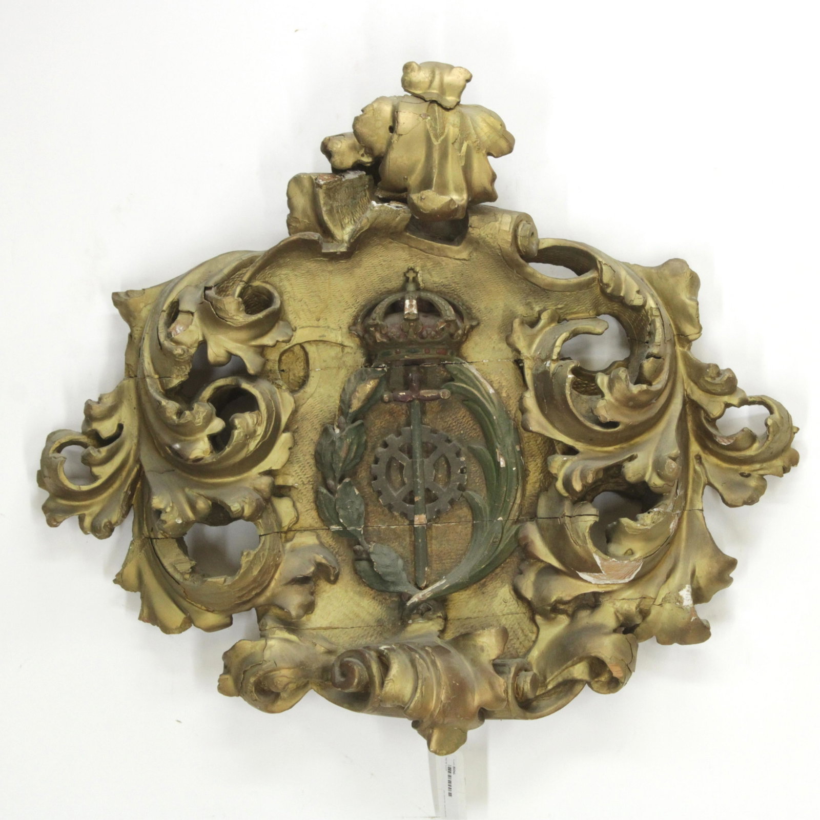 Italian Rococo Style Armorial Crest, St. Catherine: Italian Rococo Style Giltwood Armorial Crest of Saint Catherine (RIJO806)(MS) Dimensions: 26" H x 31" W Property From the Estate of Richard I Johnson (1925-2020), Chestnut Hill, Massachusetts. Mr. Joh