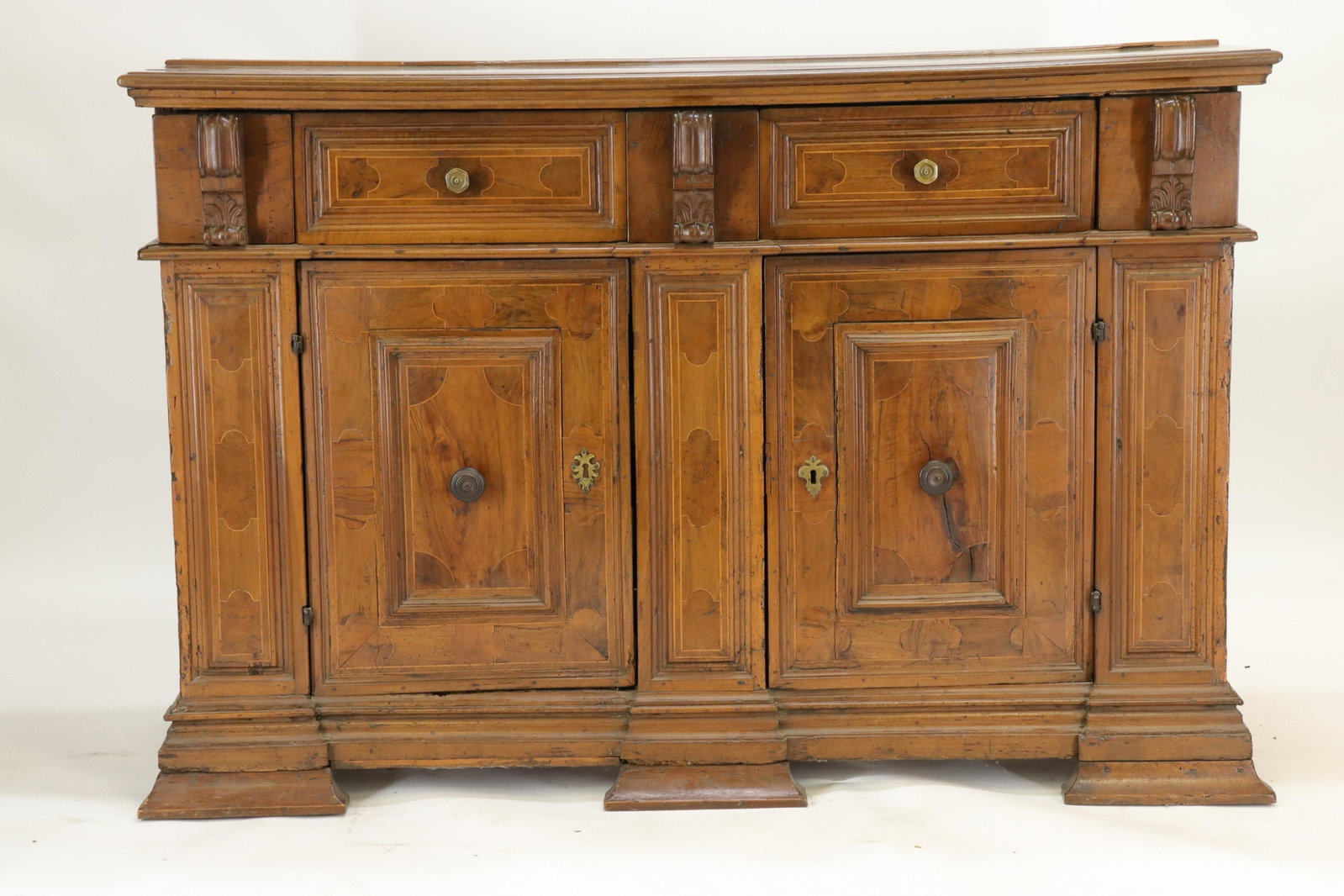 Italian Inlaid Baroque Credenza, 17th C: Italian Baroque Credenza, 17th C., inlaid walnut, bronze & wood pulls (RIJO2371)(WT) Dimensions: 44" H x 67" L x 22" D Property From the Estate of Richard I Johnson (1925-2020), Chestnut Hill, Massach