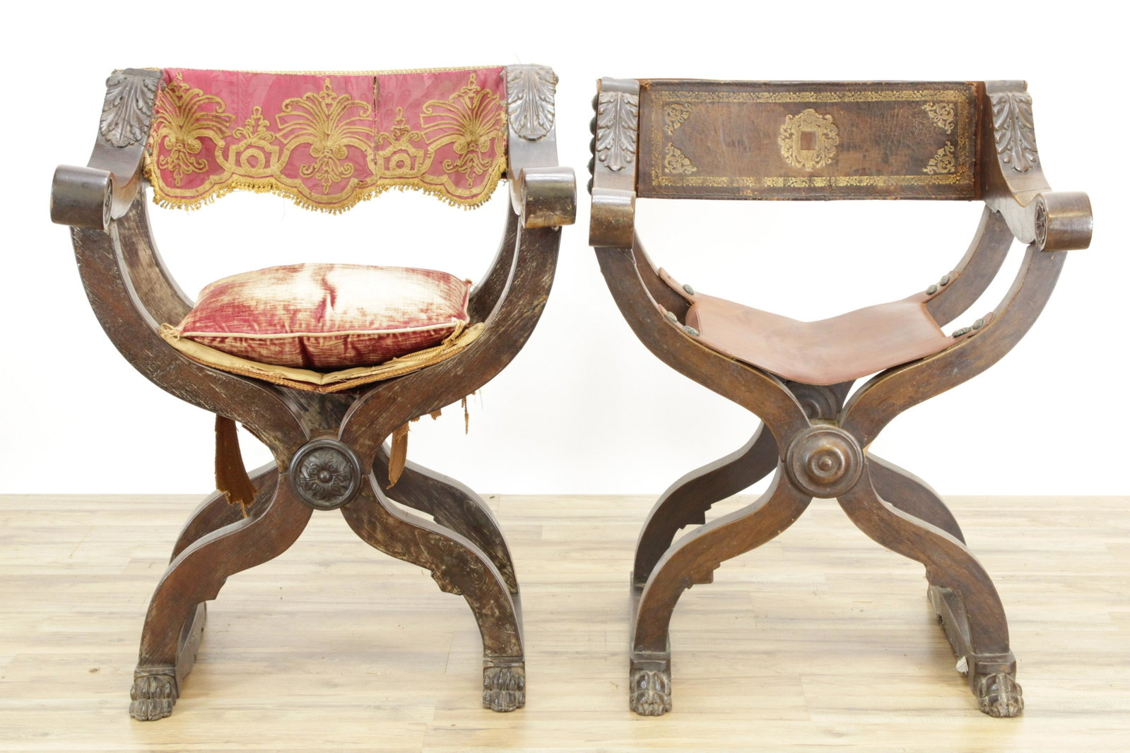 2 Italian Baroque Curule Style Chairs: 2 Italian Baroque Curule Style Chairs, walnut, one with leather back & seat, the other red velvet (RIJO2362/2)(WT) Dimensions: 36" H x 27 1/2" W and 35" H x 27" D Property From the Estate of Richard I