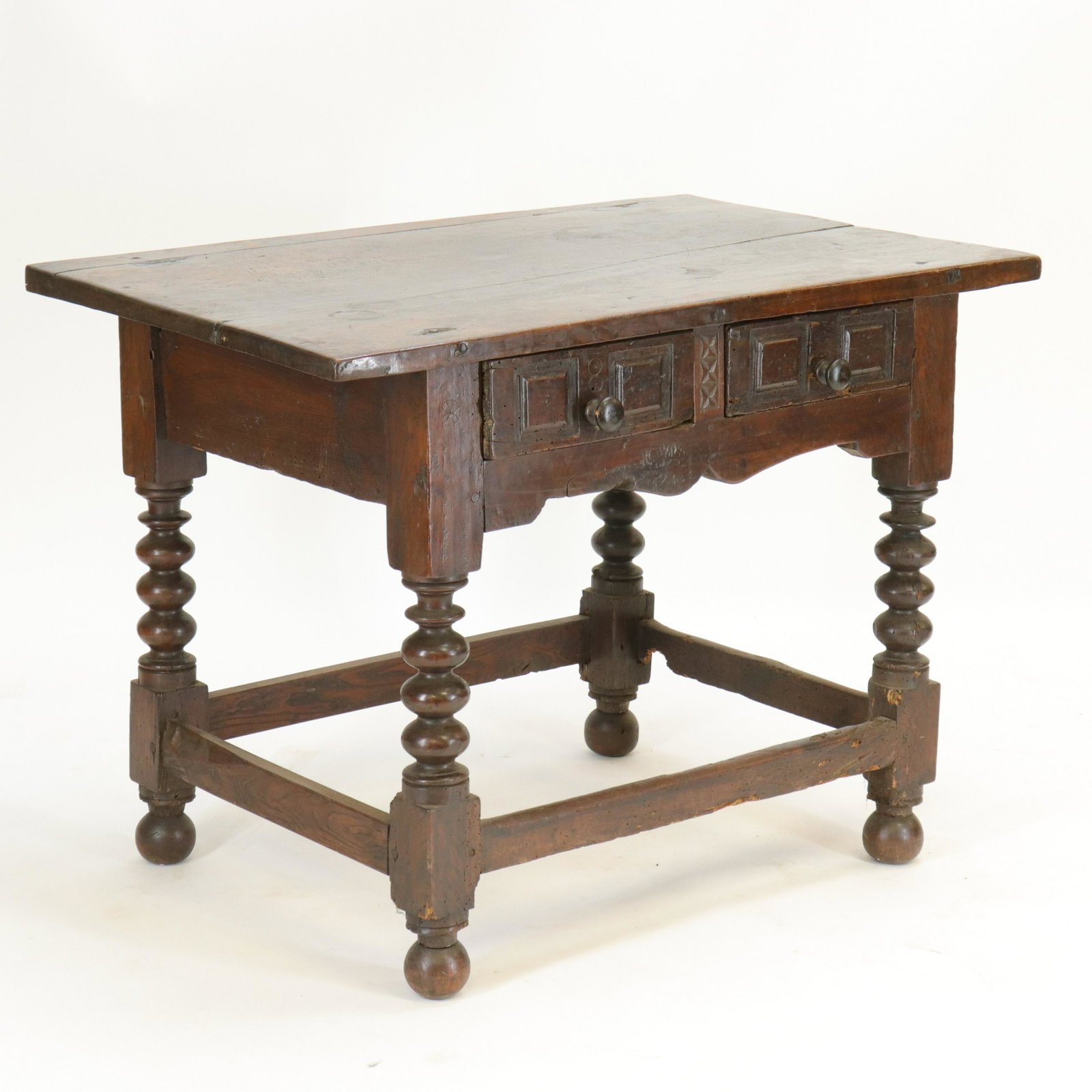 Spanish Baroque 2-Drawer Side Table: Spanish Baroque 2-Drawer Side Table, walnut, bobbin turned legs (RIJO2493)(WT) Dimensions: 28 1/2" H x 39 1/4" x 25 1/2" Property From the Estate of Richard I Johnson (1925-2020), Chestnut Hill, Massa