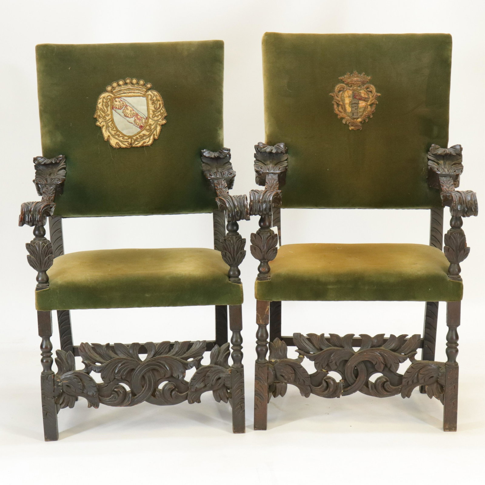 Pair Spanish Baroque Style Arm Chairs: Pair Spanish Baroque Style Arm Chairs, walnut & oak floral carvings, green velvet upholstery (RIJO2375/2)(WT) Dimensions: 45 1/2" H x 26" W Property From the Estate of Richard I Johnson (1925-2020), C