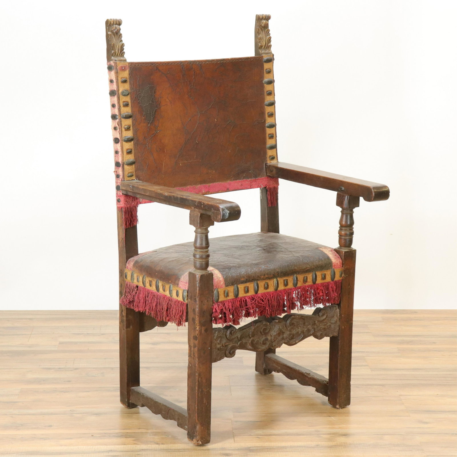 Spanish Baroque Open Arm Chair: Spanish Baroque Open Arm Chair, walnut, leather seat and back, oval metal bosses (RIJO2481)(WT) Dimensions: 47 1/2" H x 24" W x 22" D Property From the Estate of Richard I Johnson (1925-2020), Chestnu
