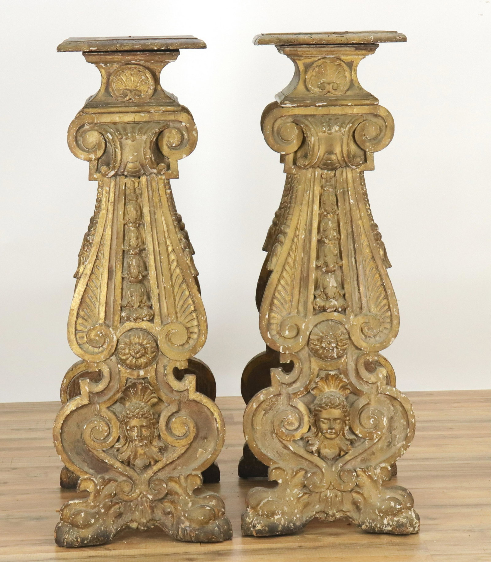 Pair North Italian Late Baroque Urn Stands, 17th C: Pair North Italian Late Baroque Urn Stands, 17th C., carved and gilded with putti heads, bell flowers and more, bears the deaccession number on the back 33E277B (RIJO2486)(WT) Dimensions: 48" H x 17" 