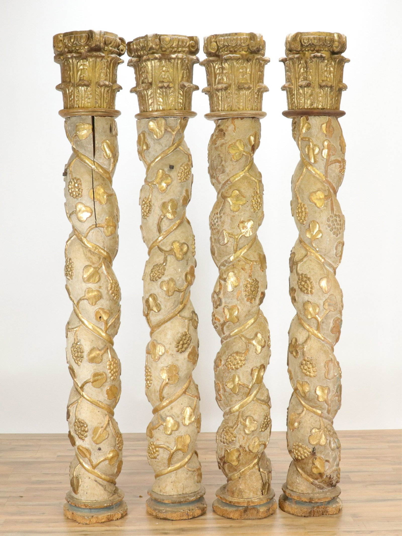 4 Italian Baroque Solomonic Columns, 17th C.: Set of 4 Italian Baroque Solomonic Columns, 17th C., carved, polychromed & parcel gilt pine, twist turned with grape vines in relief, with capitals (RIJO2501/4)(WT) Dimensions: 78" H Property From the