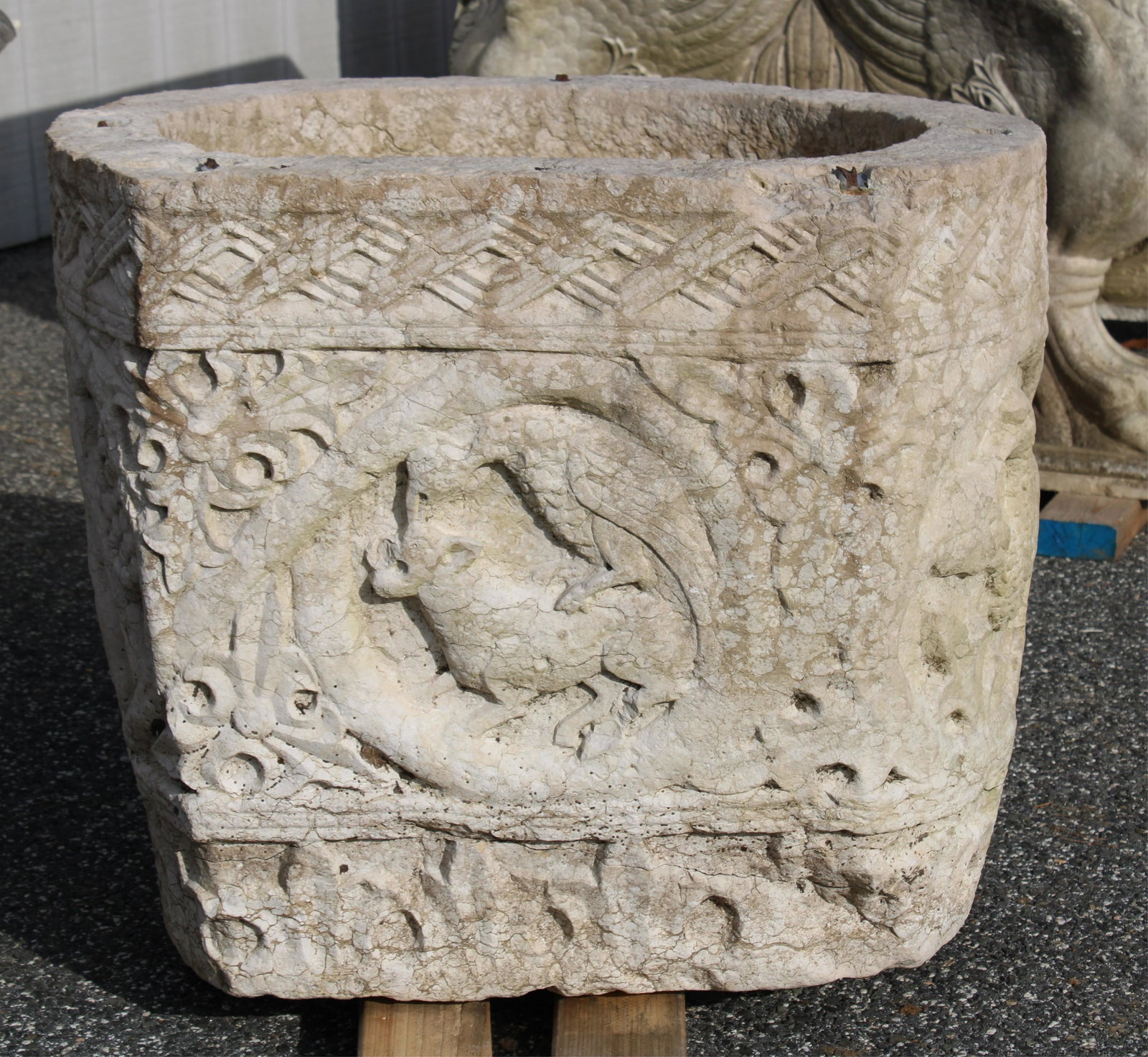 Medieval Carved Limestone Font, 17th C./earlier: Medieval Carved Limestone Font, 17th C. or earlier, carved with reserves of phoenix and hounds (RIJO808)(MS) Dimensions: 22 1/2" H x 27 1/2" Dia. Property From the Estate of Richard I Johnson (1925-20