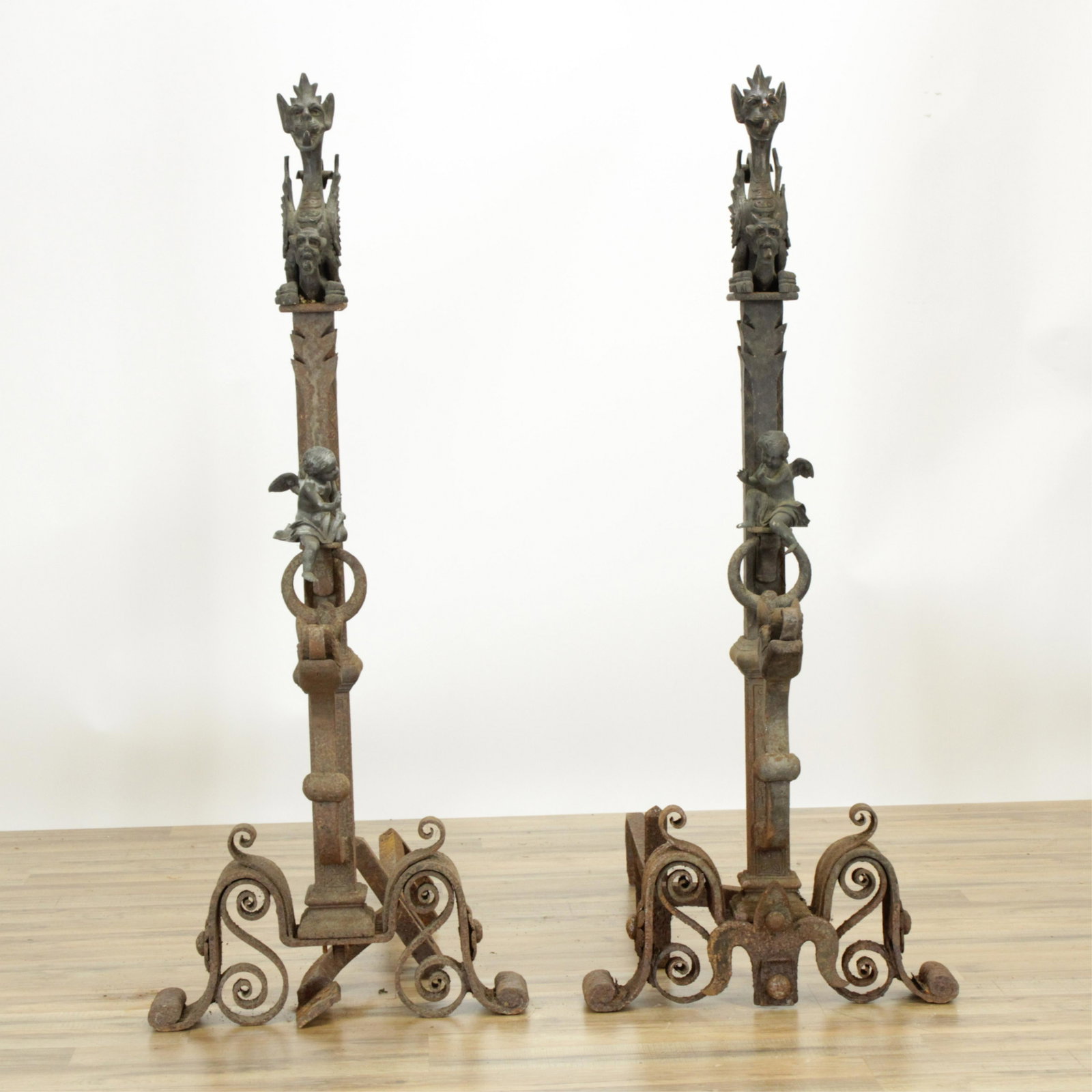 Pair of Renaissance Style Palace Andirons, 19th C.: Pair of Renaissance Style Bronze & Wrought Iron Palace Andirons, 19th C., with griffins & putti (RIJO872/2)(MS) Dimensions: 47 1/2" H x 24" W x 22" D Property From the Estate of Richard I Johnson (192