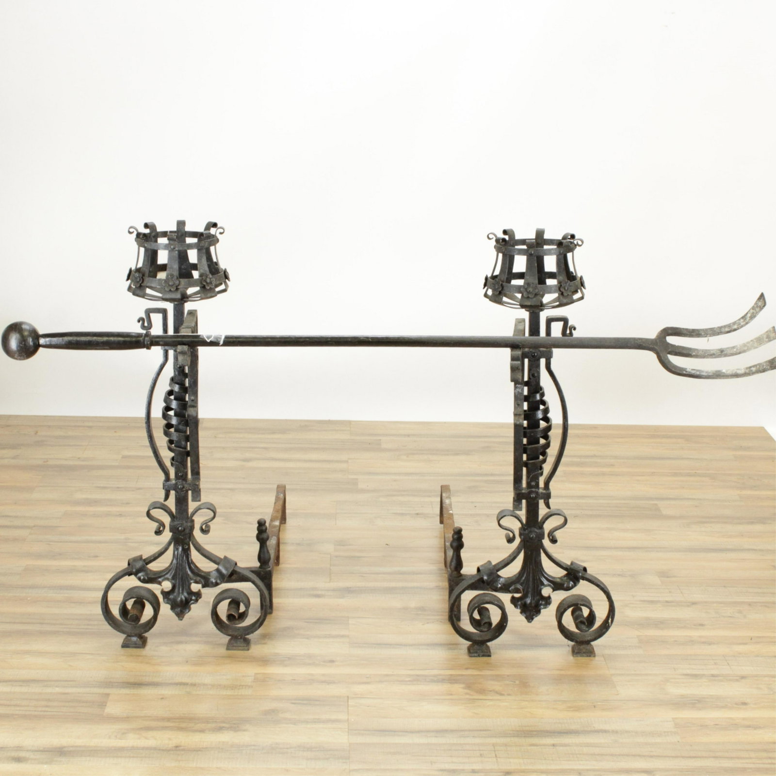 Pair Renaissance Revival Style Andirons/Tool: Pair Renaissance Revival Style Wrought Iron Andirons and Fire Tool (RIJO873/3)(MS) Dimensions: 39" H Property From the Estate of Richard I Johnson (1925-2020), Chestnut Hill, Massachusetts. Mr. Johnso