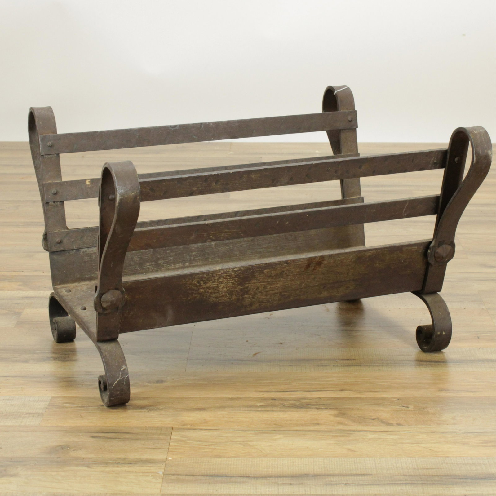 Baroque Style Wrought Iron Log Rack: Baroque Style Wrought Iron Log Rack (RIJO875)(MS) Dimensions: 14 3/4" H x 22 1/4" W x 19 3/4" D Property From the Estate of Richard I Johnson (1925-2020), Chestnut Hill, Massachusetts. Mr. Johnson's e