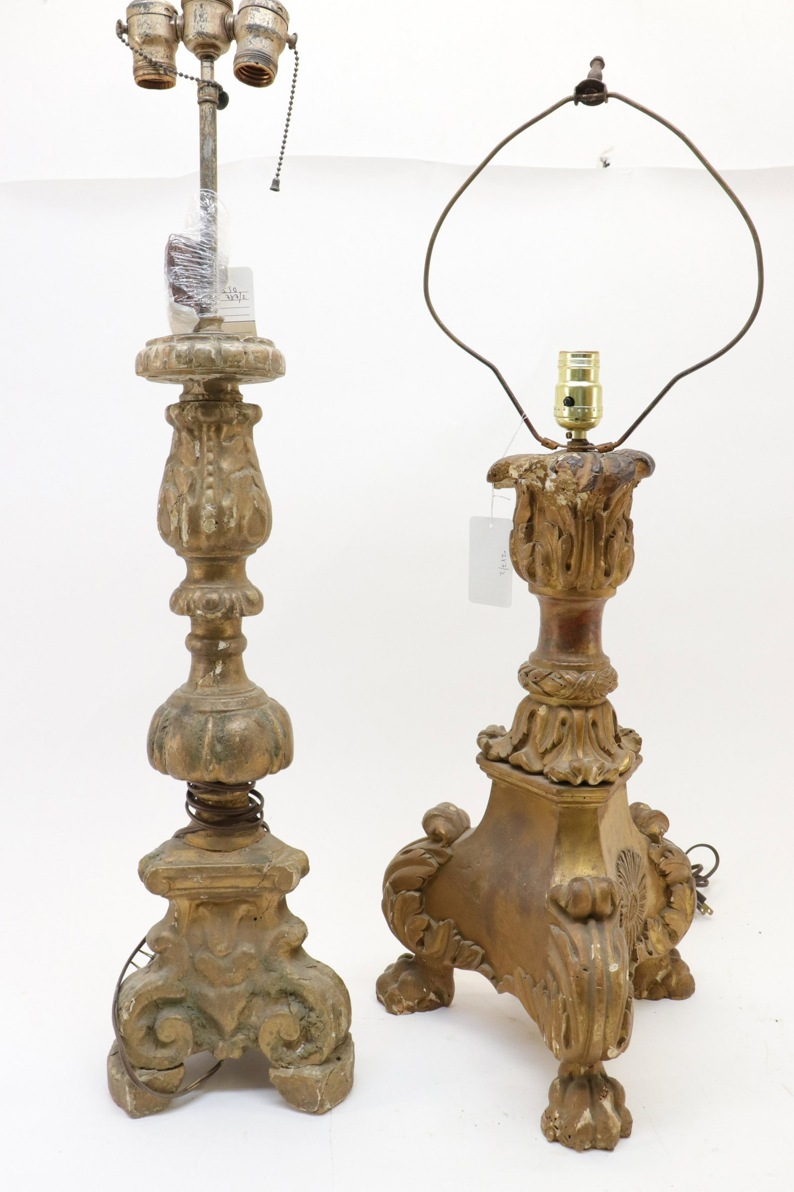 2 Continental Baroque Gilt Candlesticks, 18th C.: Two Continental Baroque Giltwood Candlesticks, 18th C., fitted for electricity (RIJO787/2)(MS) Dimensions: The larger to the finial 34" H Property From the Estate of Richard I Johnson (1925-2020), Che