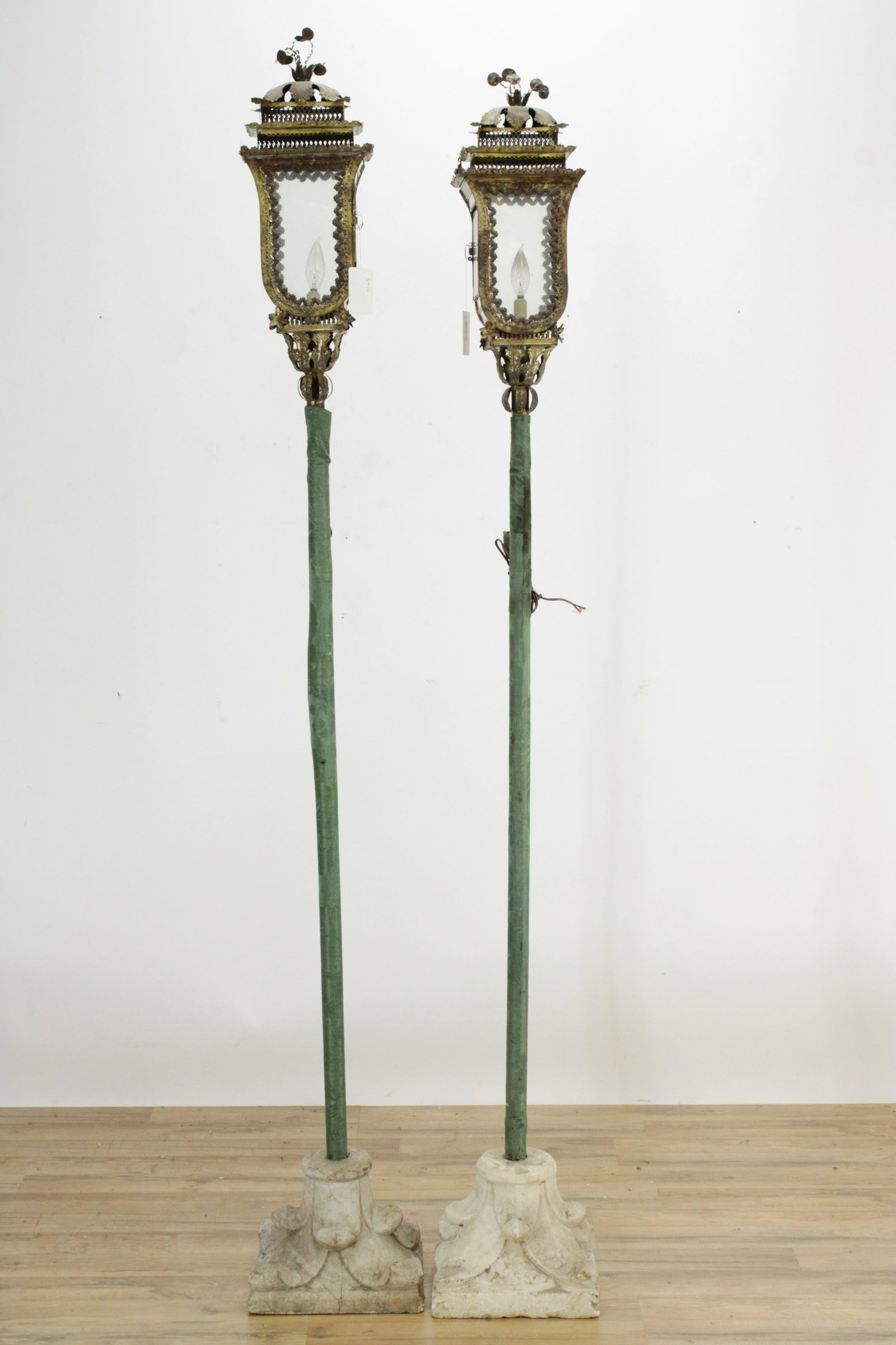 Pair of Venetian Gilt Metal Lanterns: Pair of Venetian Gilt Metal Lanterns, with Medieval limestone foot, originally capitals (RIJO871/2)(MS) Dimensions: 82 1/2" H Property From the Estate of Richard I Johnson (1925-2020), Chestnut Hill,