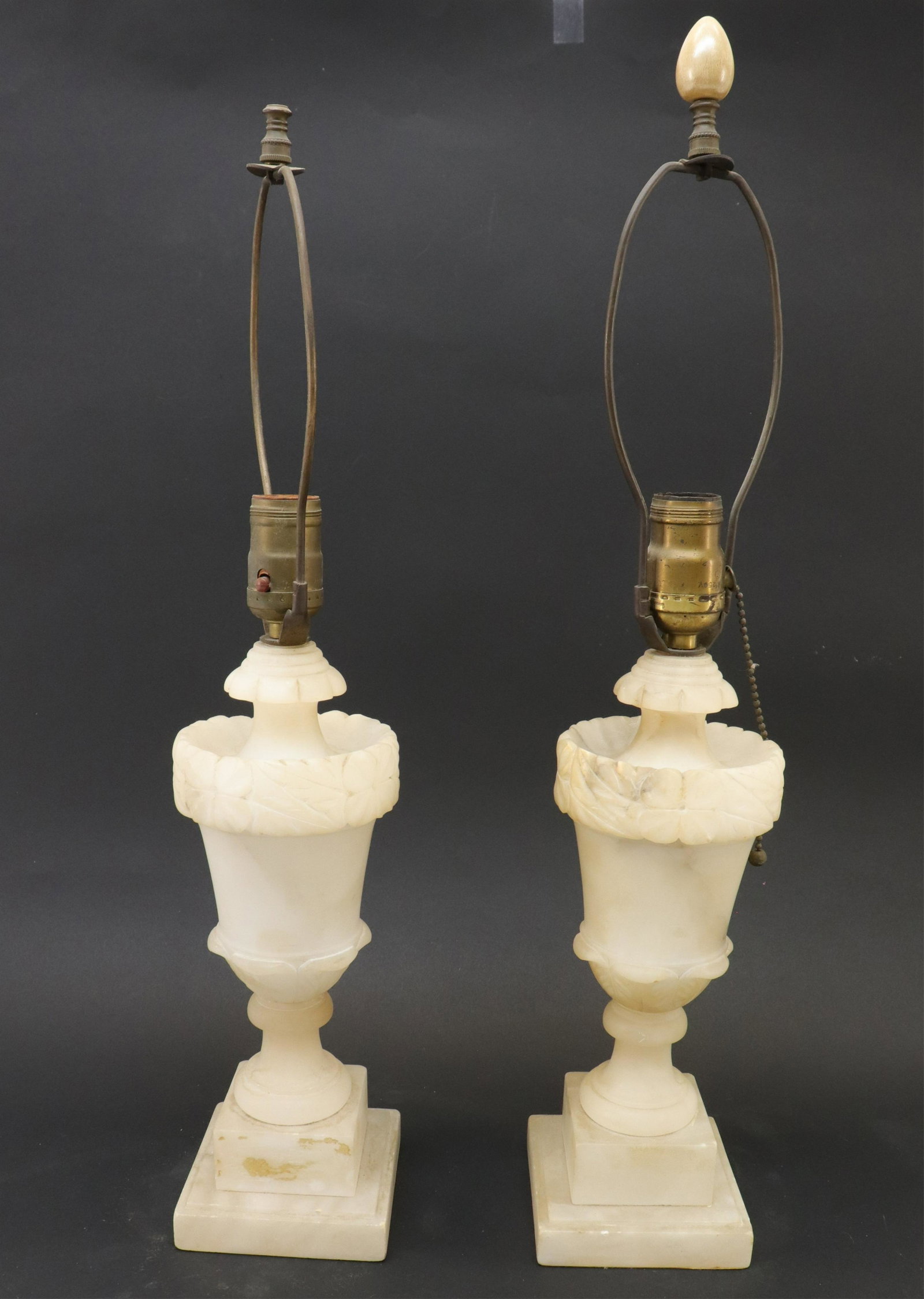Pair Alabaster Urn Form Table Lamps: Pair Alabaster Urn Form Table Lamps (RIJO2748/2)(WT) Dimensions: Lamps 12" H x 4 1/4" Sq., overall 23" H Property From the Estate of Richard I Johnson (1925-2020), Chestnut Hill, Massachusetts. Mr. Jo