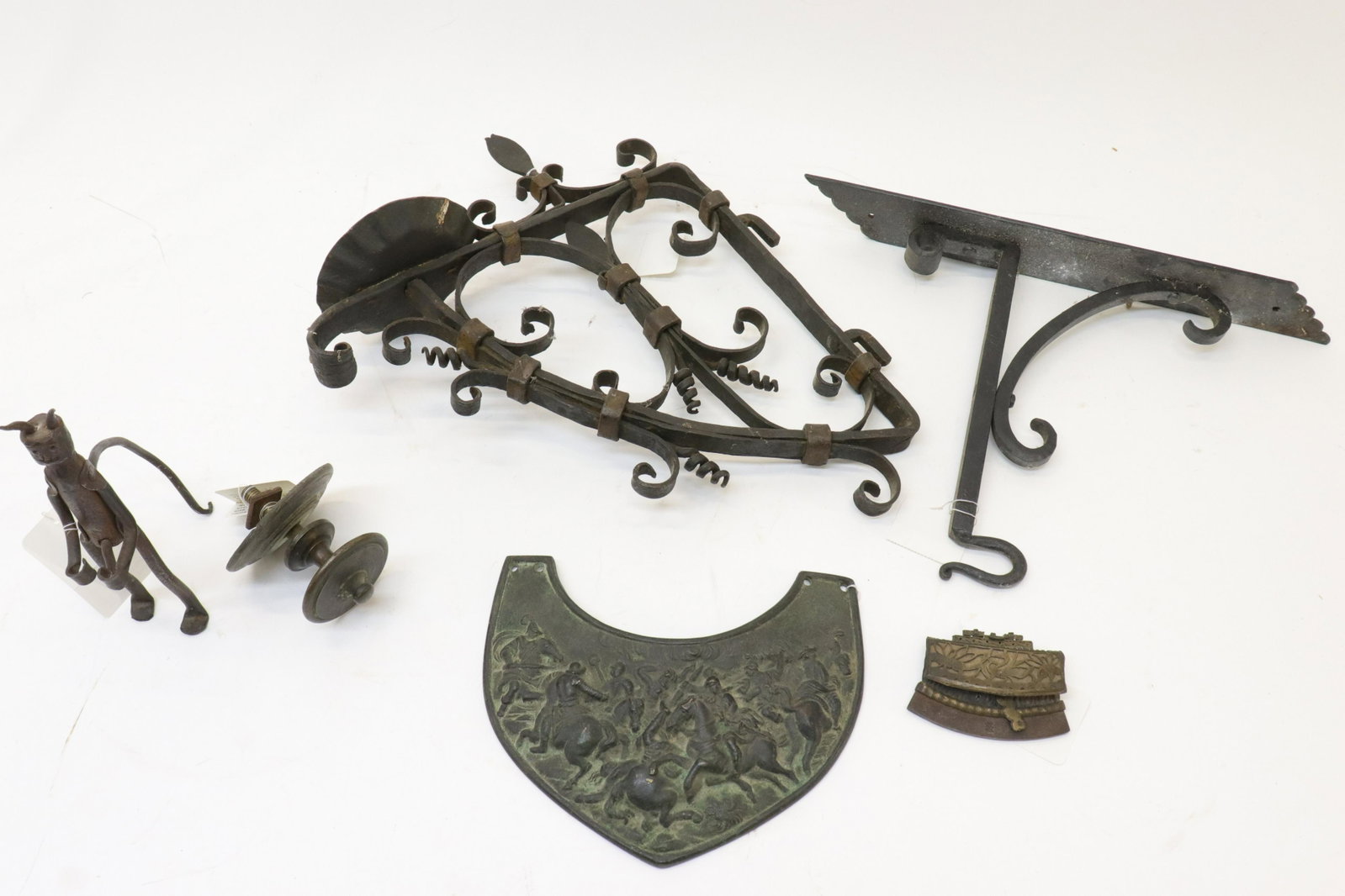 6 Baroque Style Bronze & Metal Items: Group of 6 Baroque Style Bronze & Metal Items, bronze lappet, drawer pull, small purse, figure of the devil, 2 brackets (RIJO799/6)(MS) Dimensions: Largest 15" H Property From the Estate of Richard I 