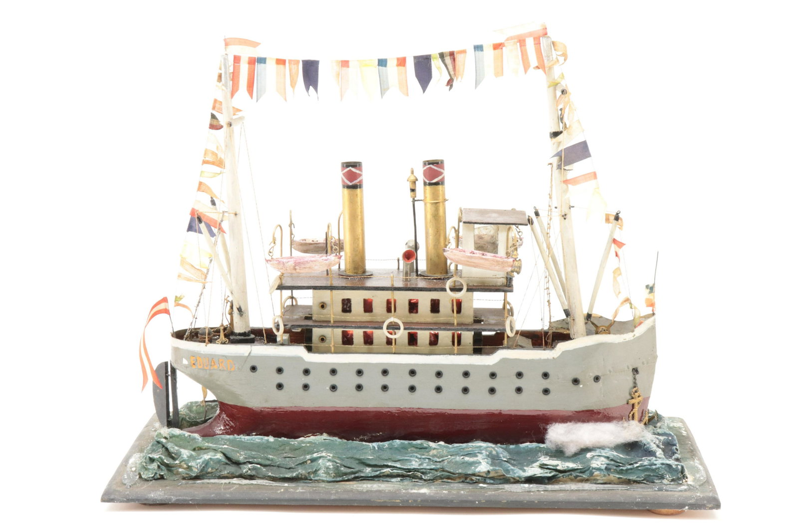 Folk Art Steamboat Diorama "Eduard": Folk Art Steamboat, "Eduard", carved and painted wood, glass case diorama (RICH2142)(WT) Dimensions: 14" H x 18 1/2" L, Case 17" H x 21 1/4" L Property from a Manhattan Estate