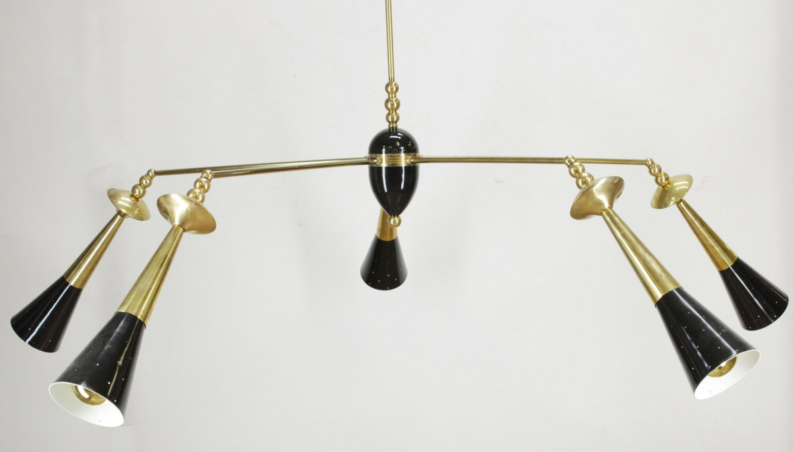 Midcentury Modern Brass Pendant Chandelier: Midcentury Modern Brass and painted metal Pendant Chandelier, painted conical shades, with newer canopy (MALM2408)(MM) Dimensions: 58"W x 33"H Property from a West Hartford, CT collection