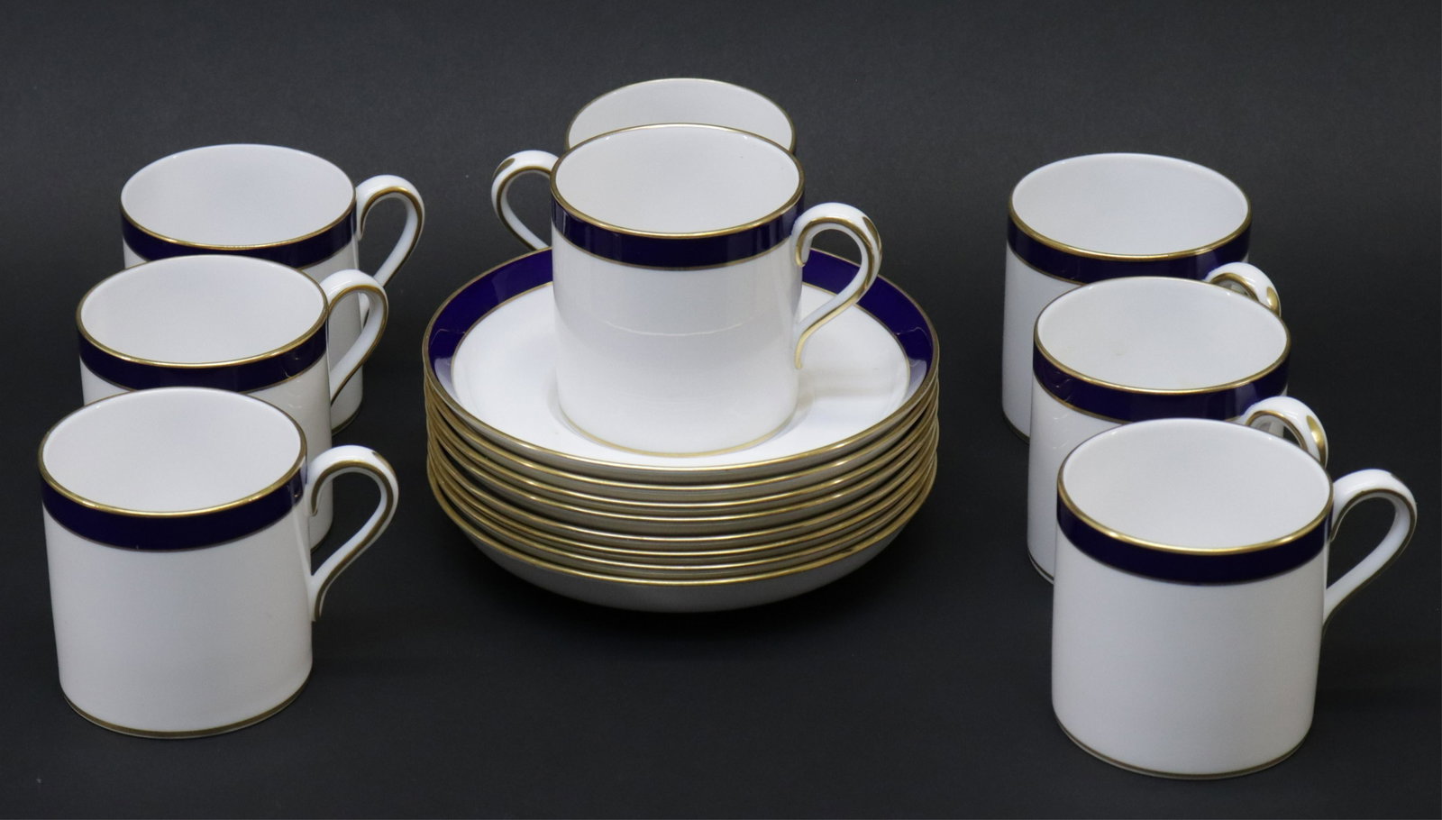 8 Spode Porcelain Demitasse & Saucers: 8 Spode Porcelain Demitasse & Saucers, blue/gold rim (DVIA3049)(WT) Dimensions: 2 1/2" H x 2 1/2" Dia.