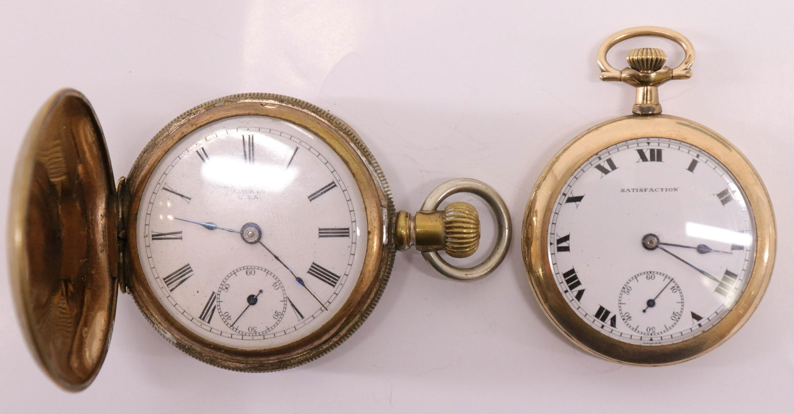 Pocket Watches: Satisfaction and N.Y. Standard: 1.Satisfaction with machine turned back. "Empire State Guaranteed 20 Years 2464791" inside back cover. 17 Jewels, Swiss made. 2. N.Y. Standard Watch Co. USA 1958761; as is. (SLWN9711/2)(JP) Dimensions