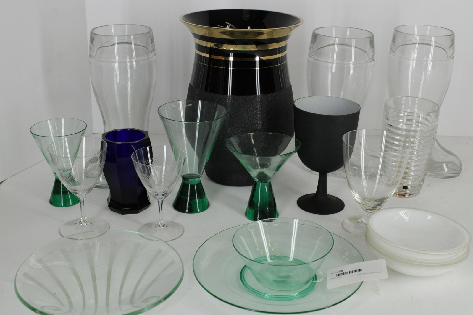 Group of Glass: Cobalt blue glass octagonal vase, 3 Austrian clear boot vases, plus others. (NJWA3458/LOT)(WT) Dimensions: Cobalt 4.5 H, Boot vases 10.5
