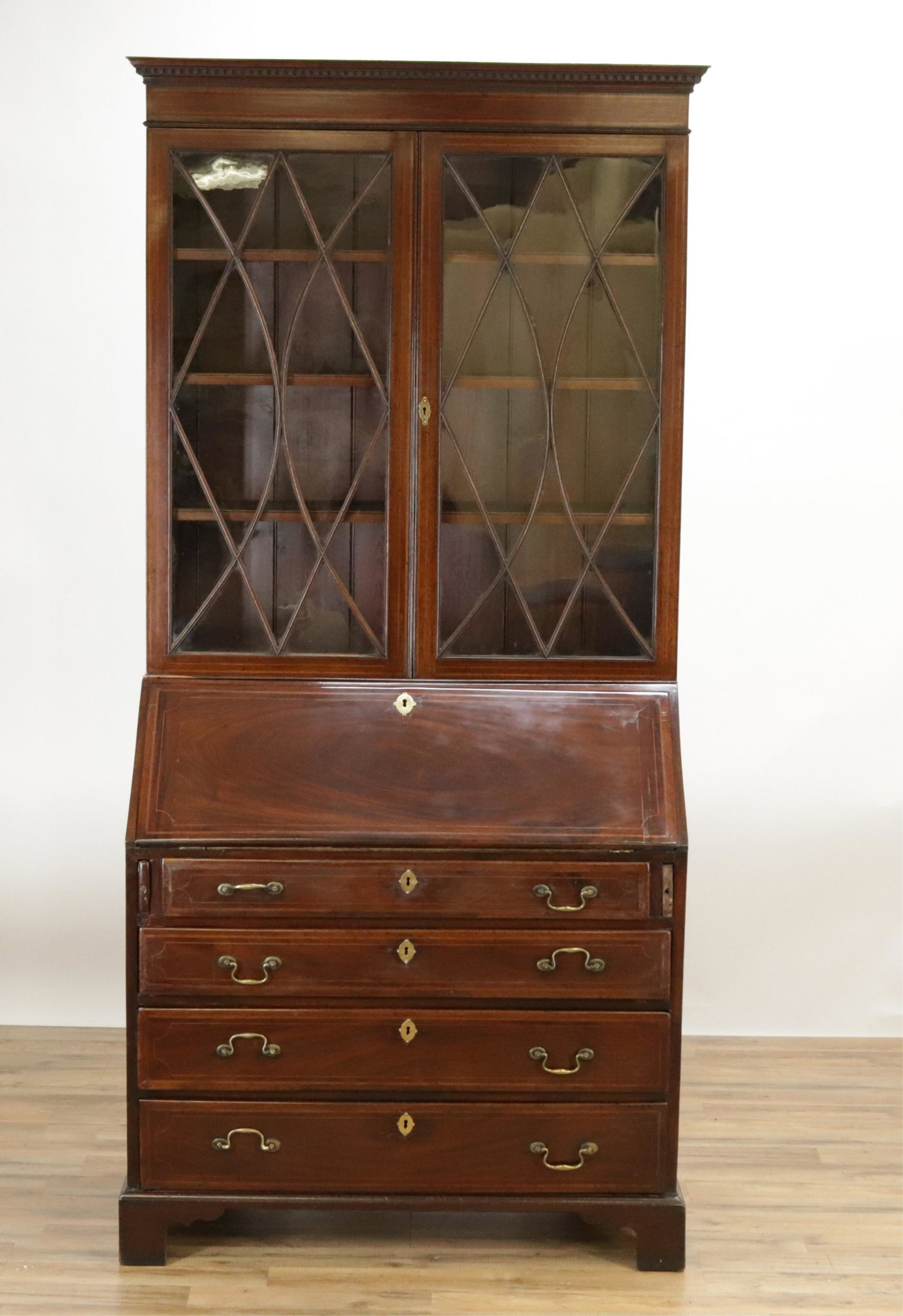 George III Inlaid Secretary Bookcase, 1800-1825: George III Inlaid Mahogany Secretary/Bookcase, 1800-1825 Provenance: Copley South Antiques. See accompanying copy of letter dated 11/9/99 (ROWE4059)(WT) Dimensions: 86 1/2" H x 41" W x 21 1/2" D Prope