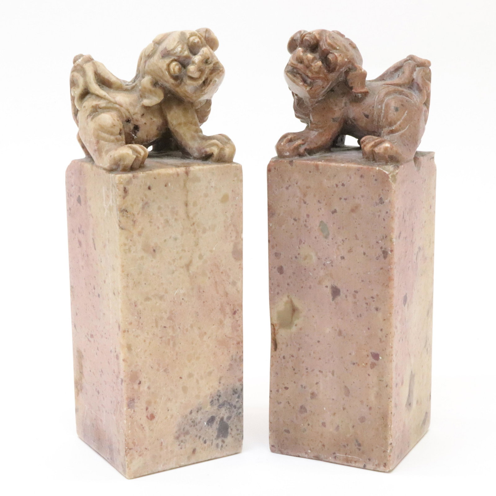 Pair of Fu Lion Soapstone Seals: Pair Soapstone Seals, surmounted by fu lions Dimensions::7 1/2" H Property from the Litchfield Estate of Tracy H. Griswold