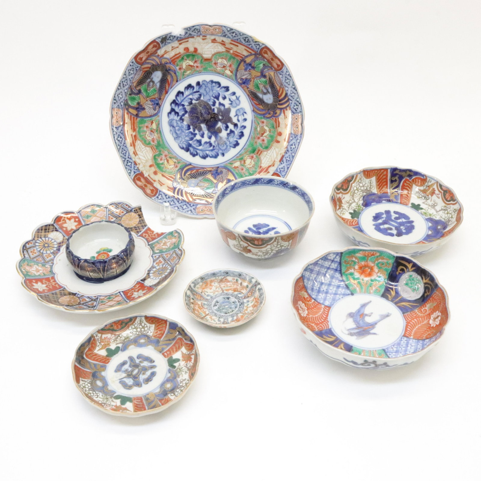Collection of Seven Imari Dishes: Collection of Seven Imari Dishes, late 19th to 20th century. Various size porcelain plates of the Japanese Imari style and patterns. Dimensions::9" diameter largest Property from a Colts Neck, New Jer